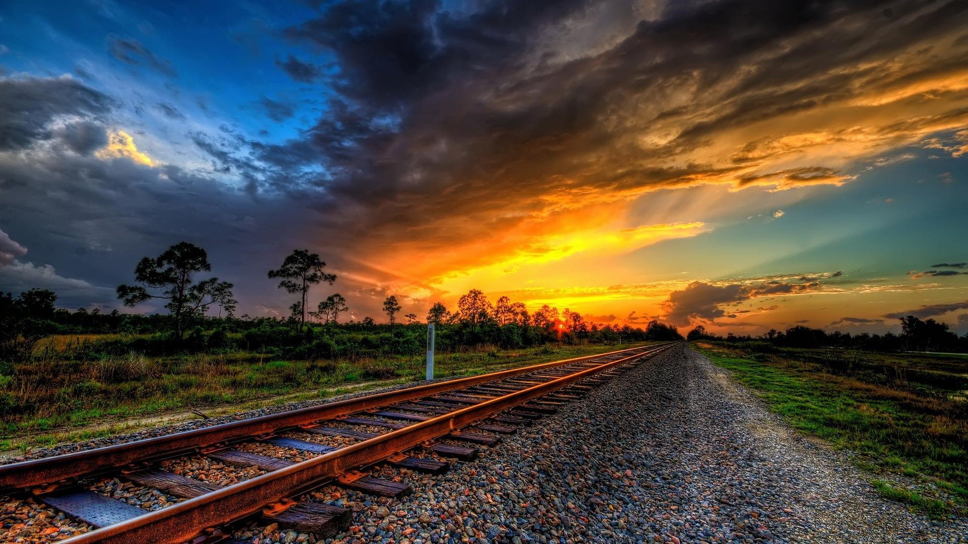 Sunset over railway tracks HD Wallpaper