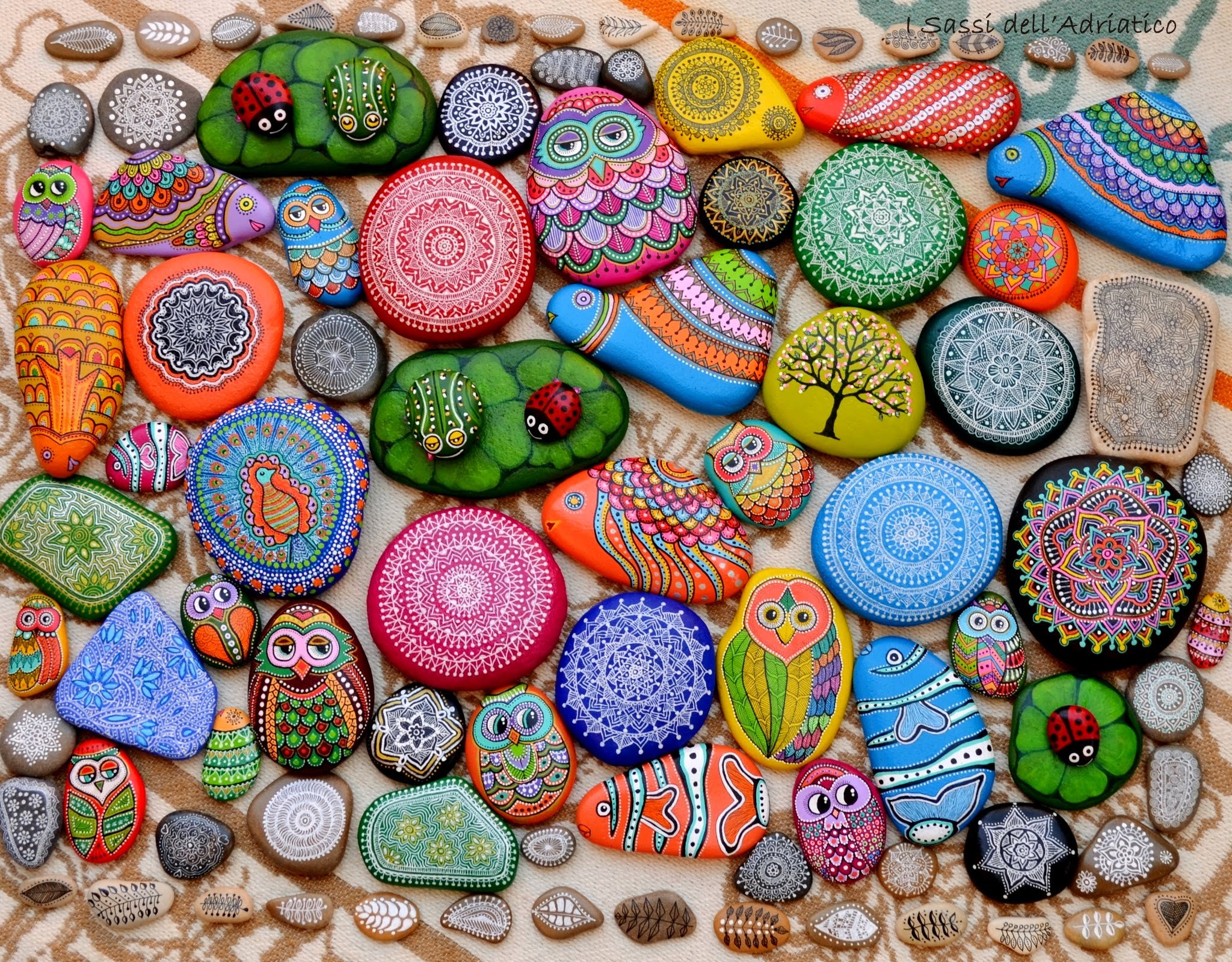Painted stones with mandala and animal designs HD Wallpaper