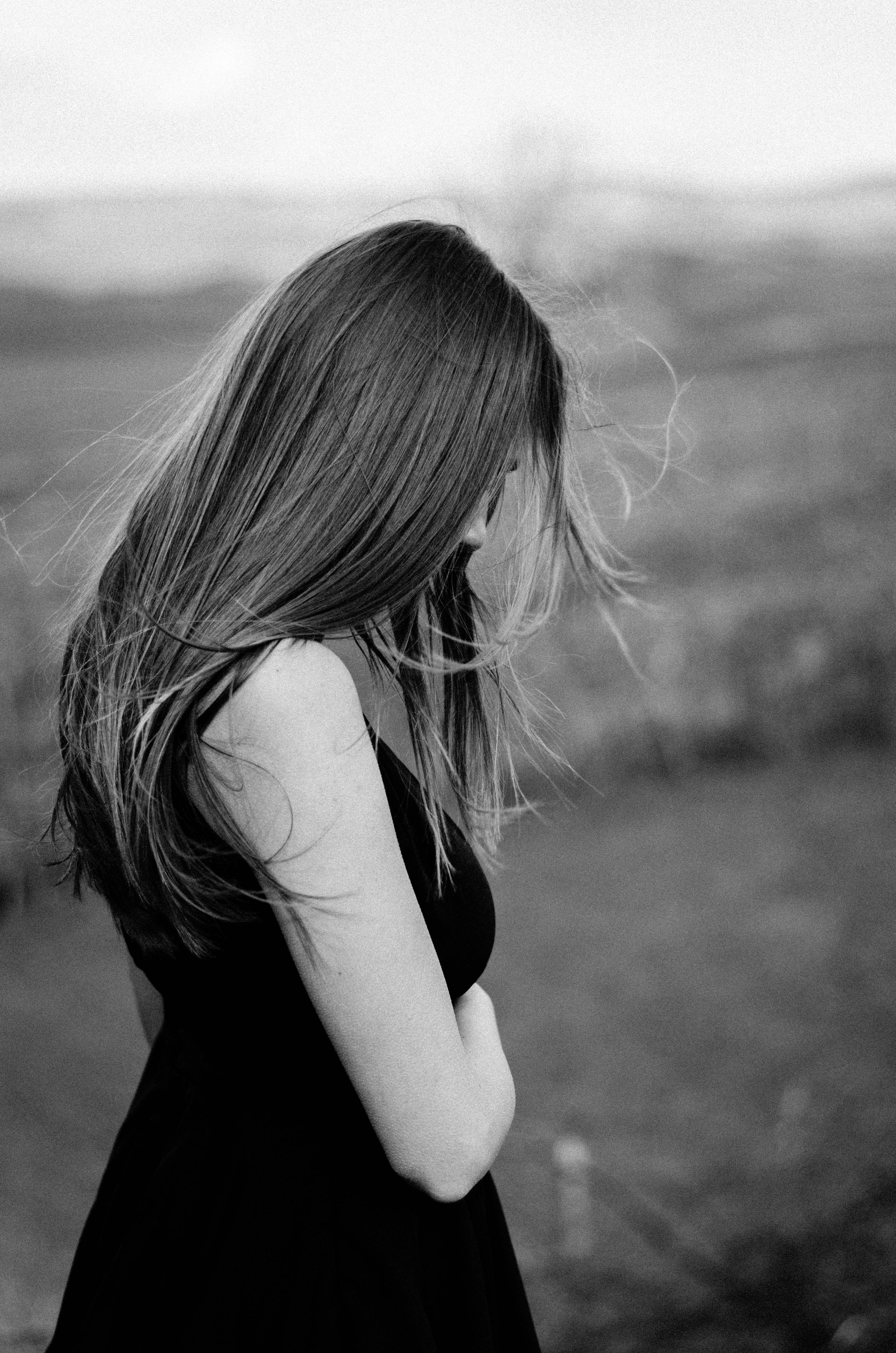 Woman in black dress with long hair HD Wallpaper