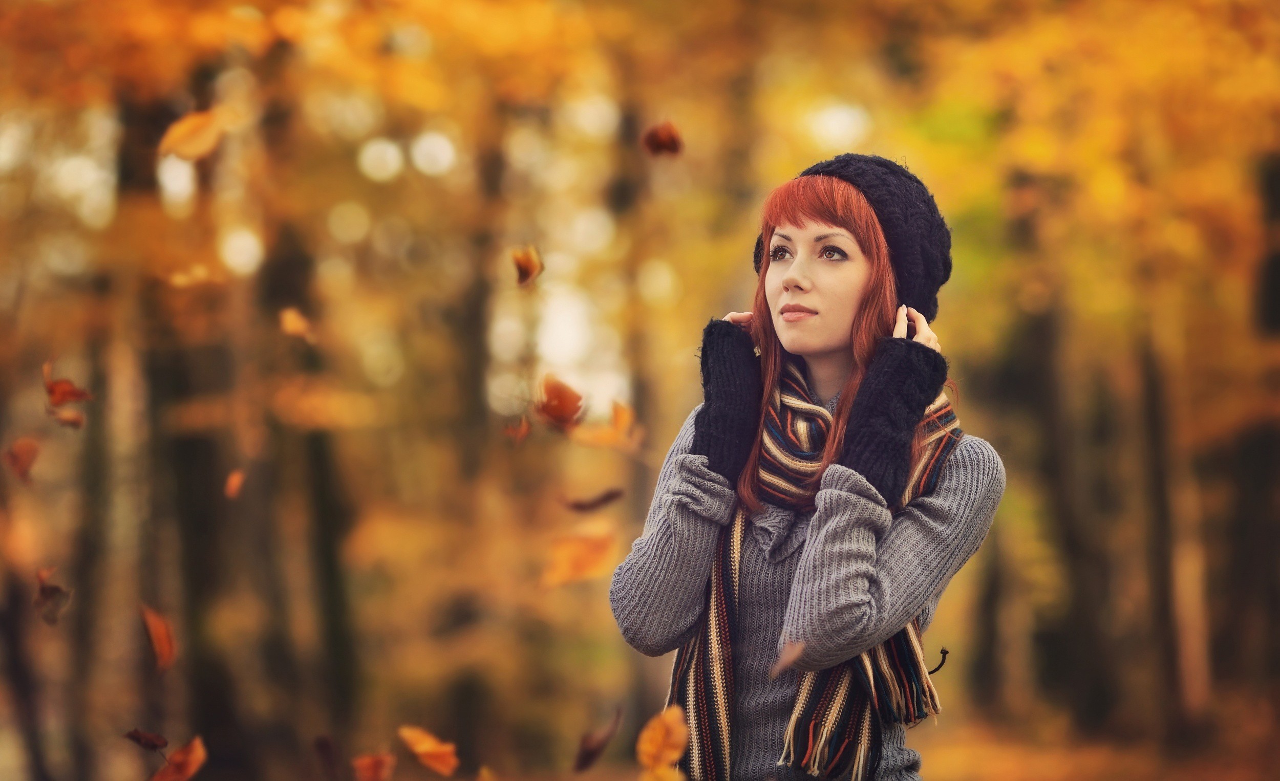 Woman in autumn park with falling leaves HD Wallpaper
