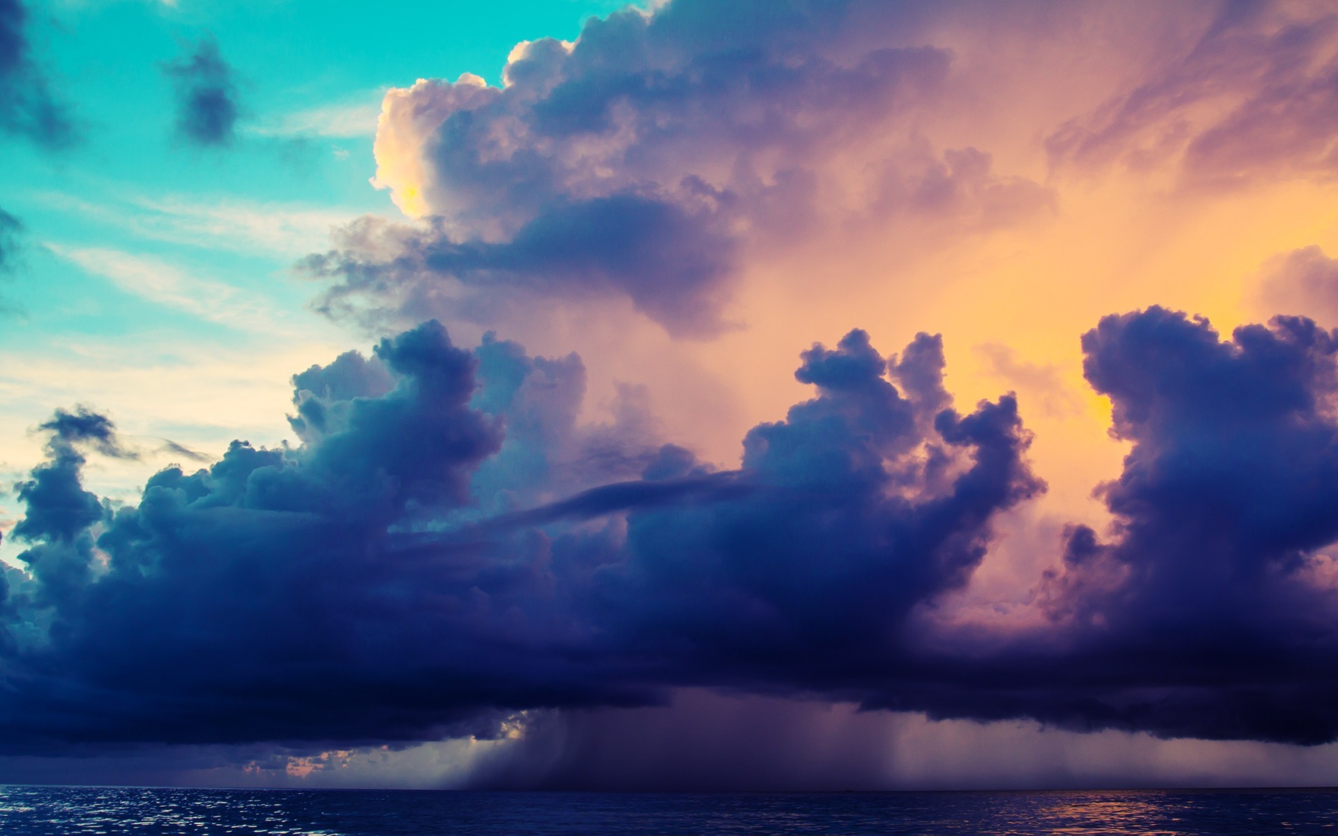 Dramatic clouds over the ocean at sunset HD Wallpaper