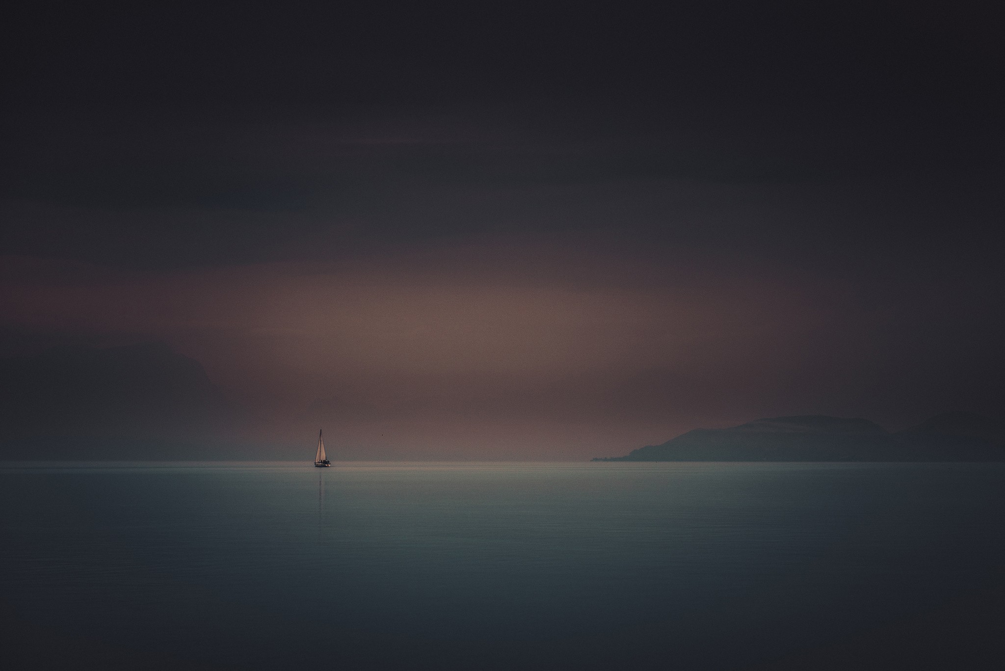 Sailboat on calm water at dusk HD Wallpaper
