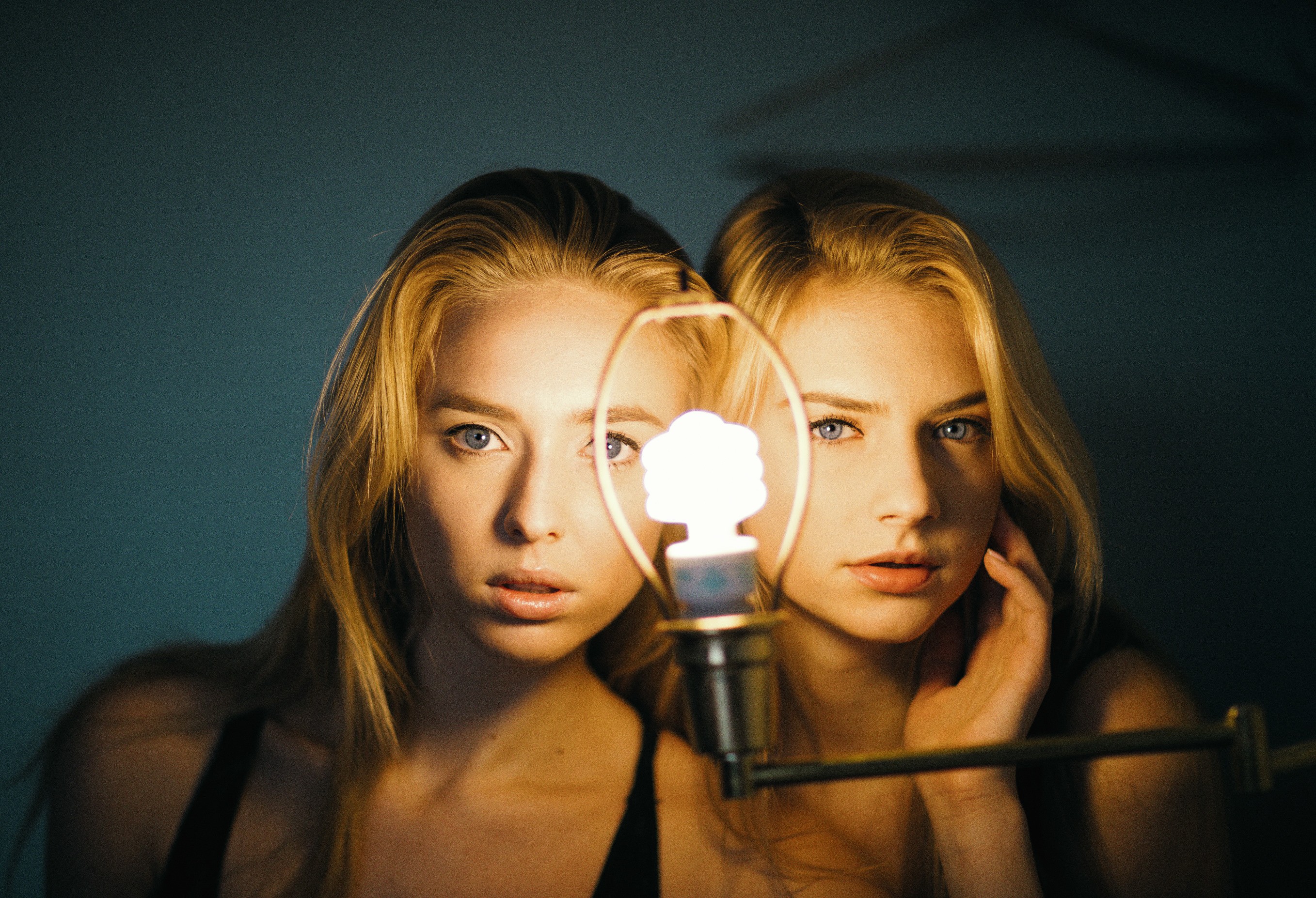 Two women and a light bulb HD Wallpaper