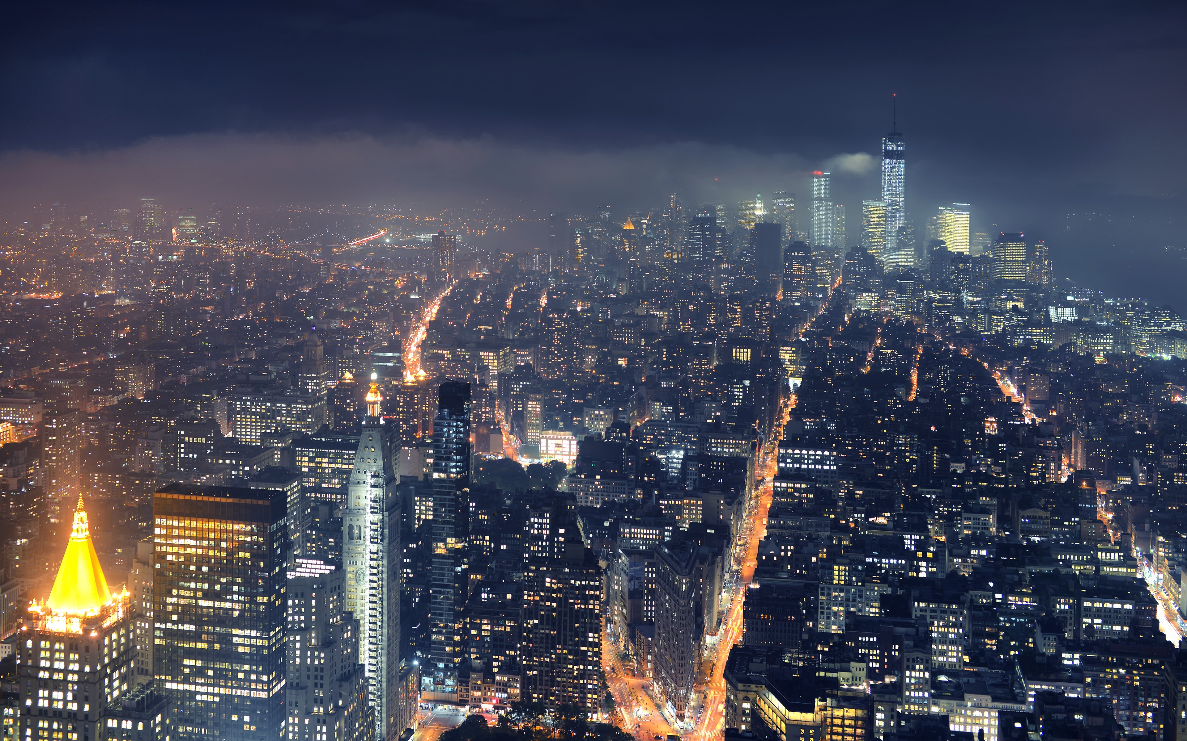 New York City skyline at night with fog HD Wallpaper