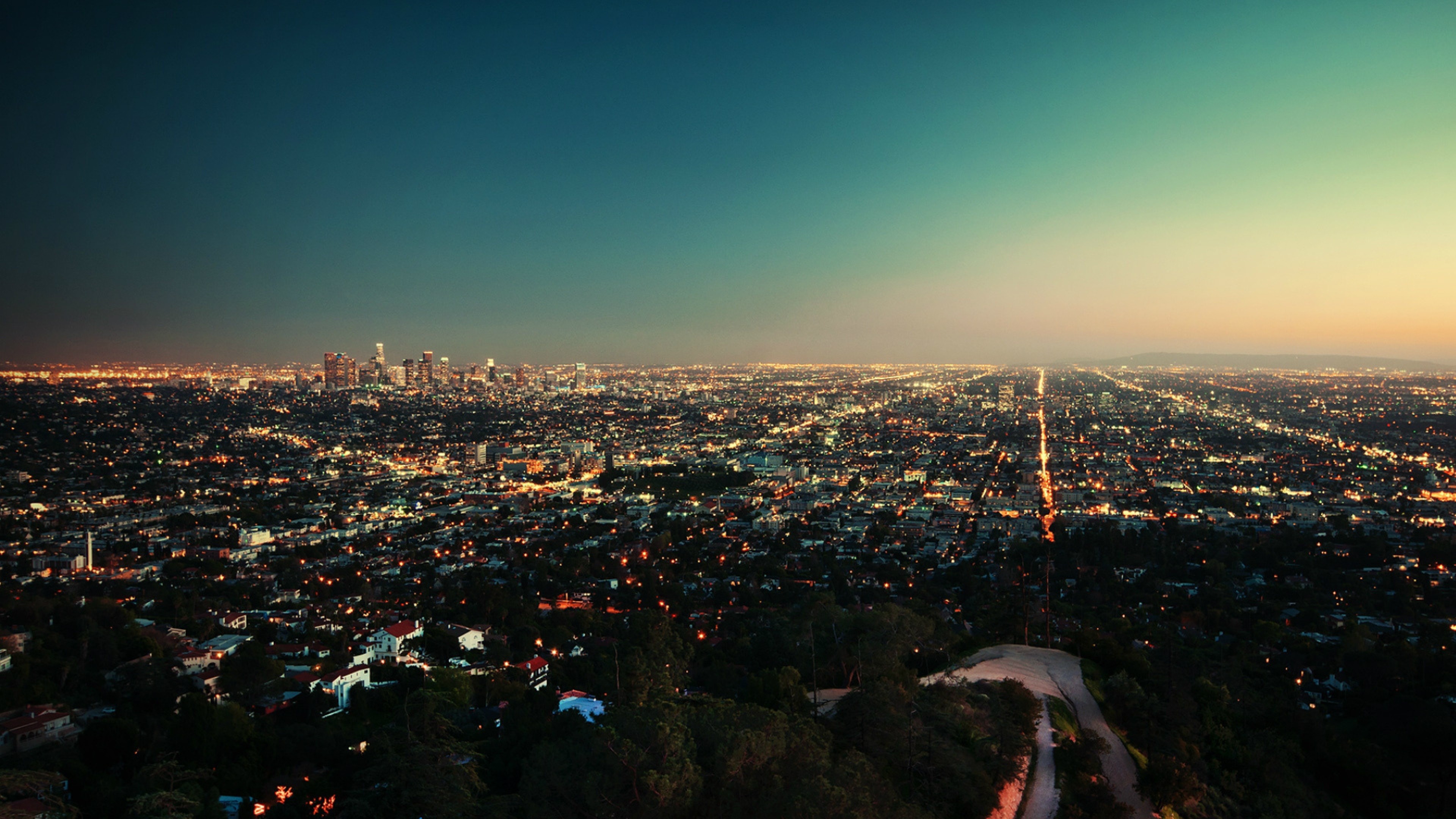 Los Angeles cityscape at dusk from a hilltop HD Wallpaper