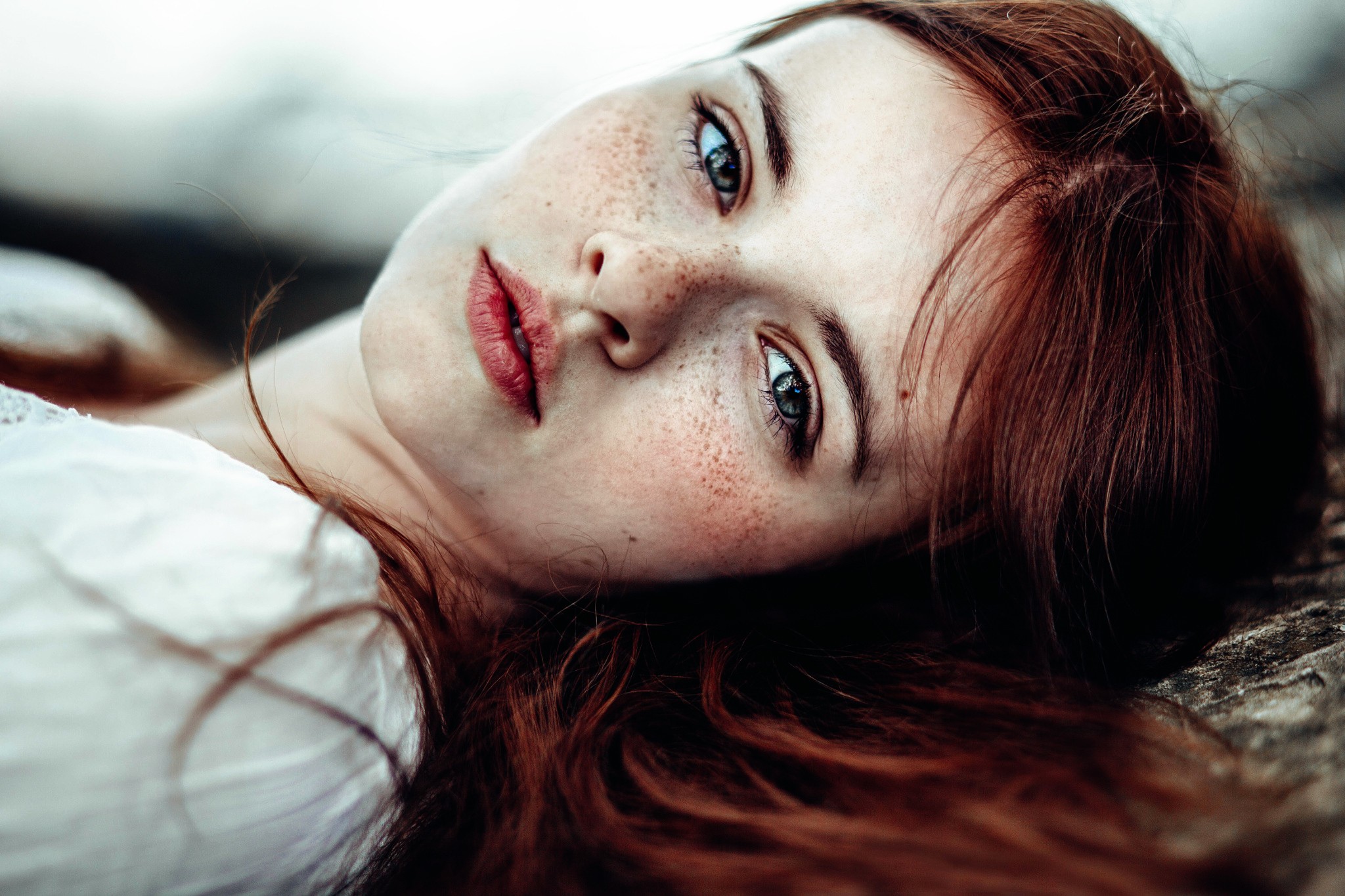 Portrait of a young woman with red hair and freckles HD Wallpaper
