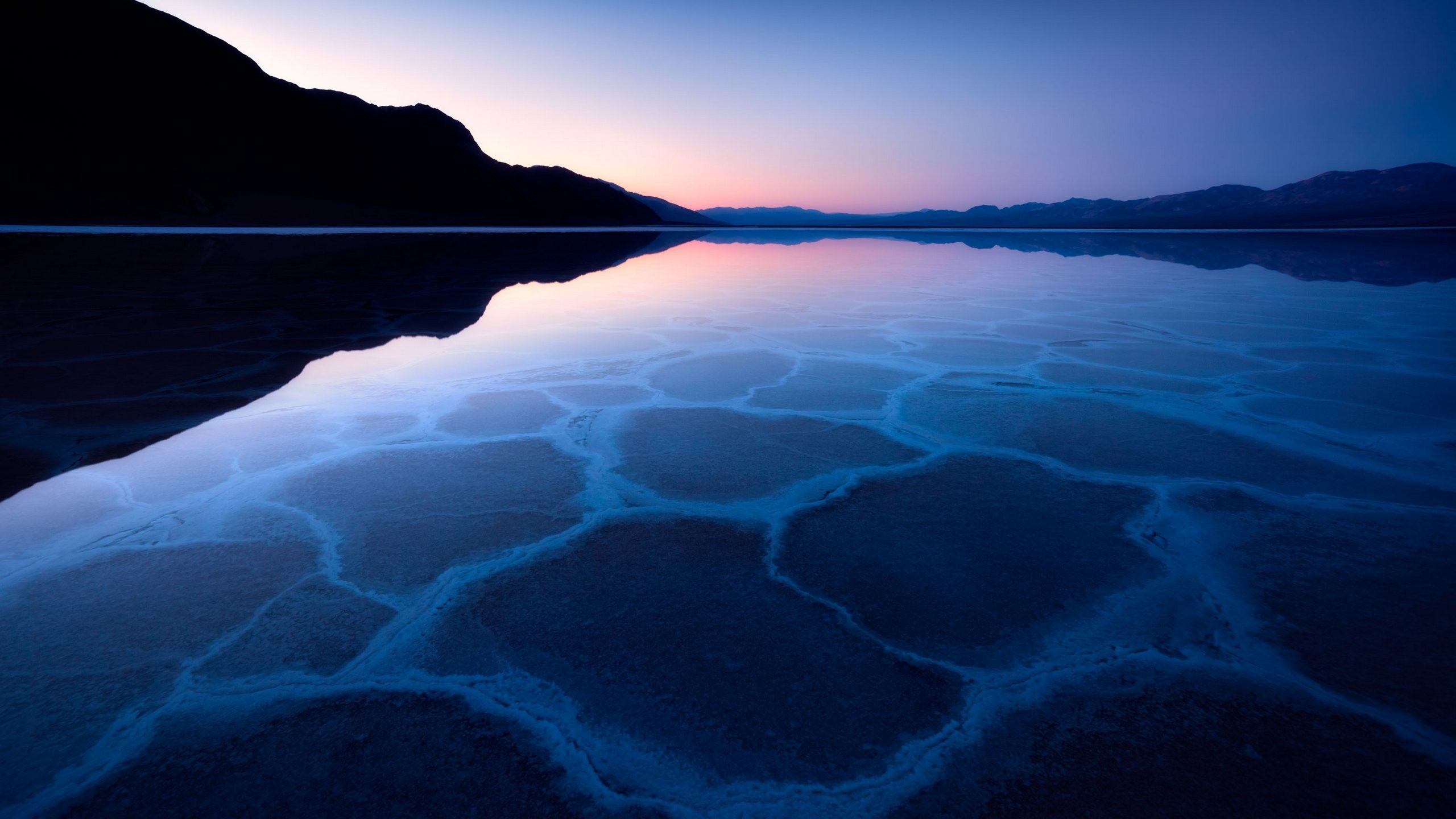 Salt flats reflecting a twilight sky HD Wallpaper