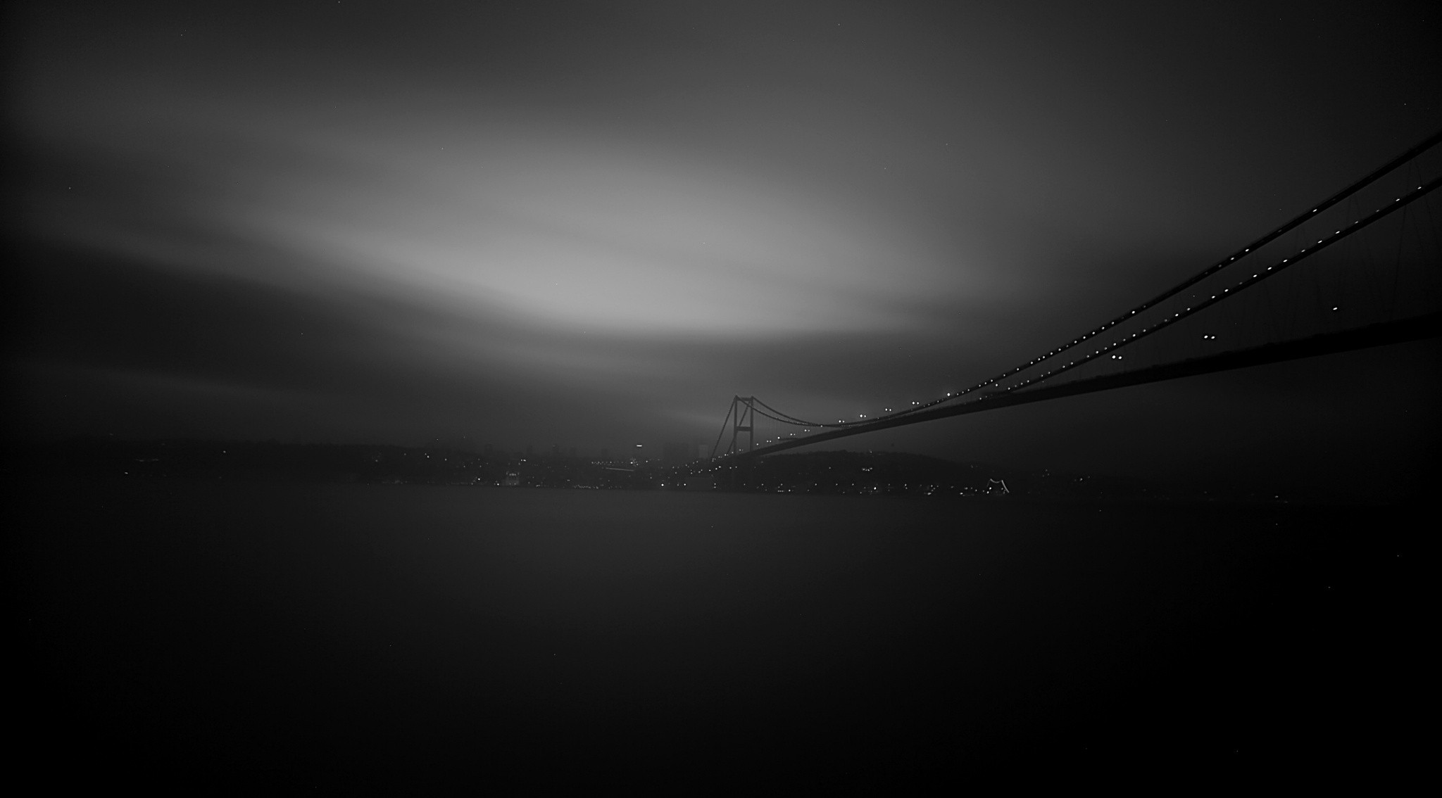 Istanbul bridge at night with city lights HD Wallpaper