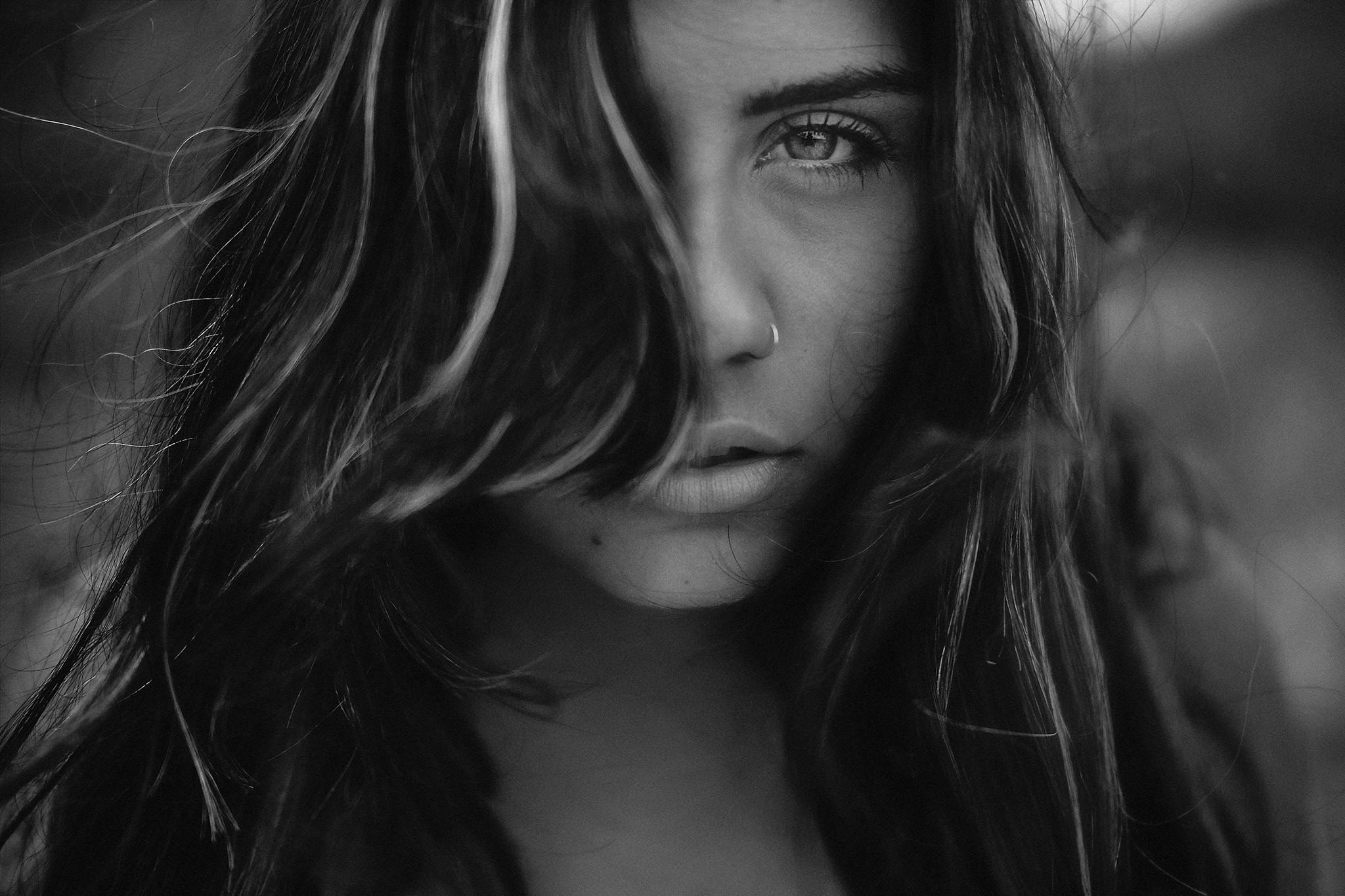 Monochrome portrait of a woman with hair obscuring her face HD Wallpaper