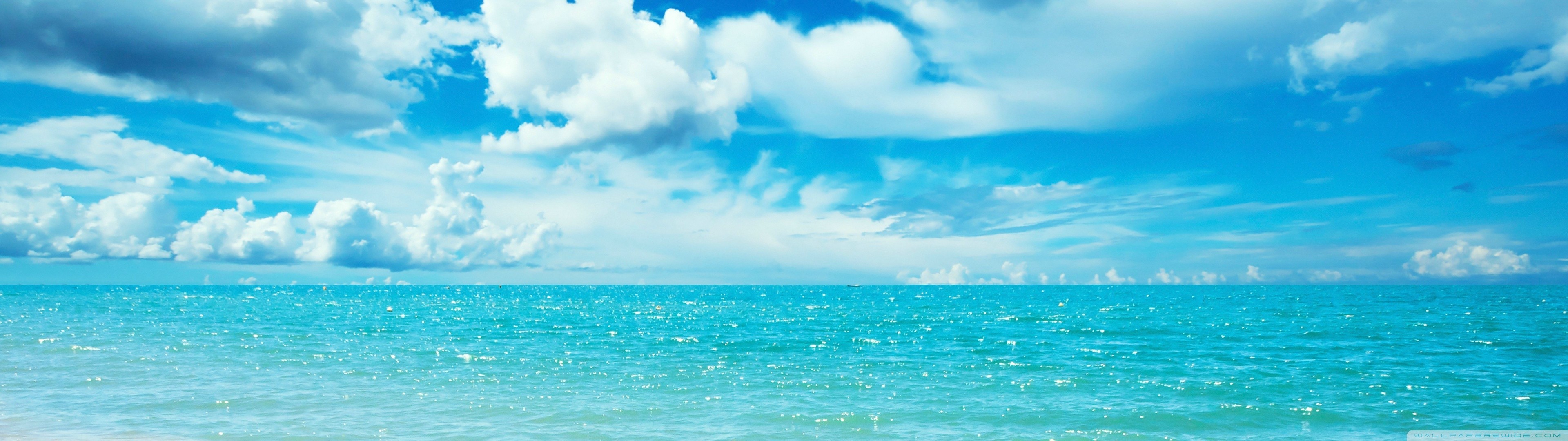 Blue sky with clouds over the ocean HD Wallpaper