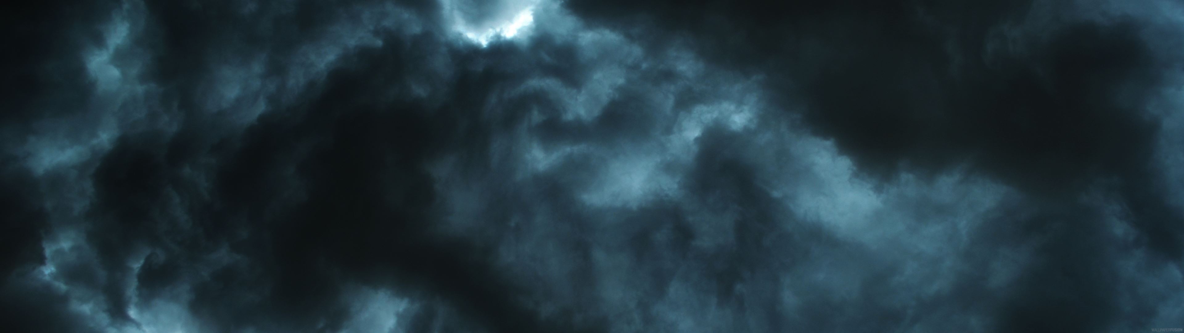 Dark stormy clouds with light breaking through HD Wallpaper