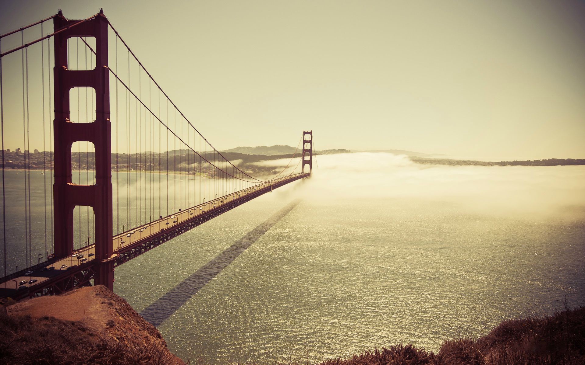 Golden Gate Bridge shrouded in fog over the Pacific Ocean HD Wallpaper