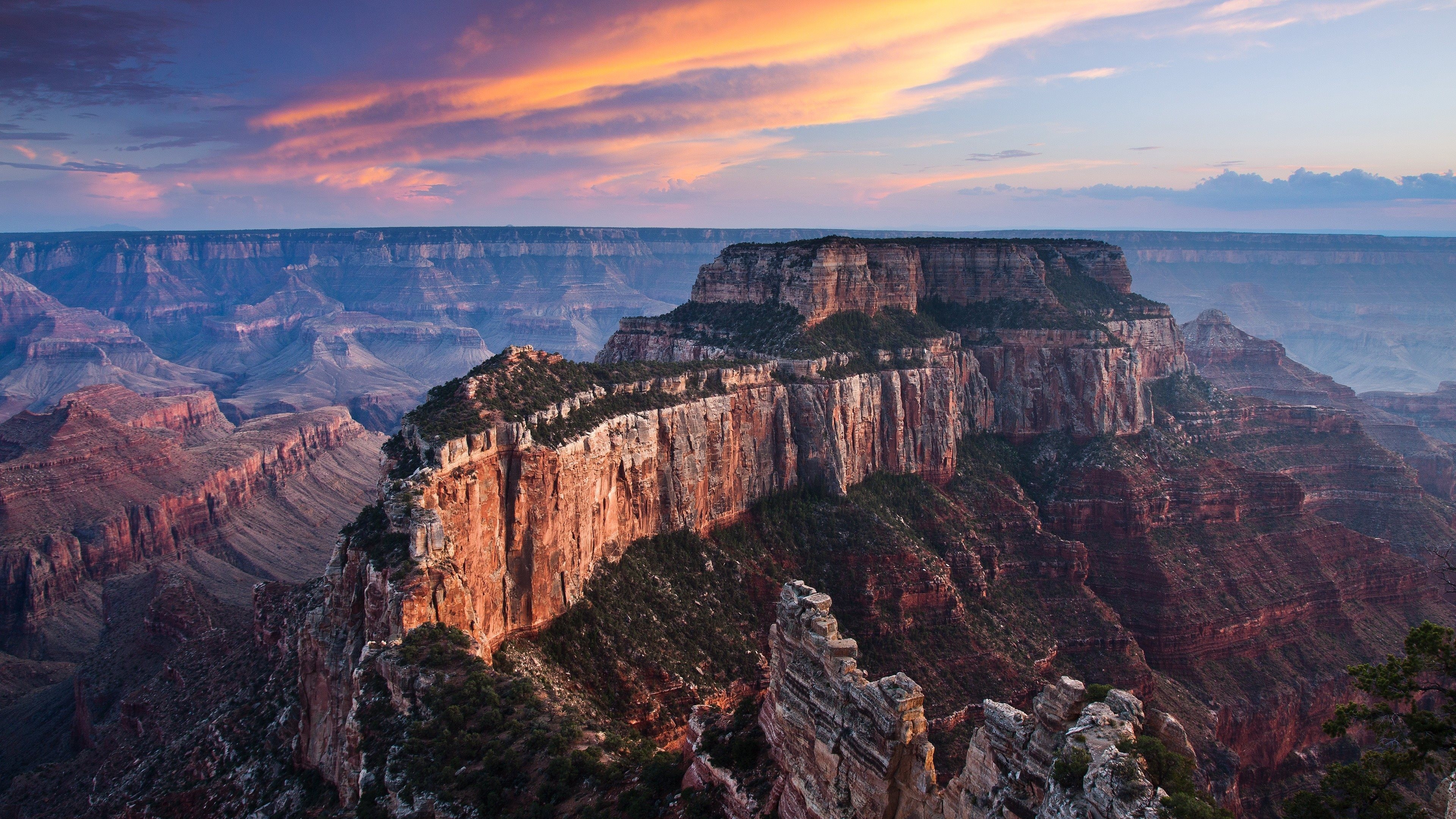 Grand Canyon at sunset with colorful clouds HD Wallpaper