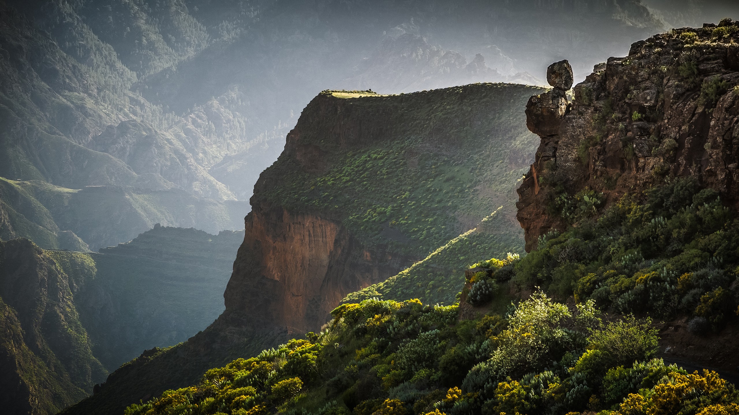 Mountain landscape with dramatic cliffs and greenery HD Wallpaper