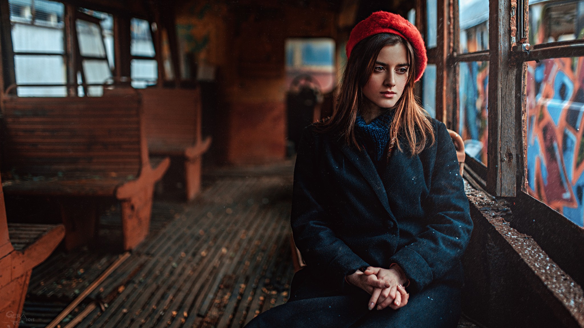 Woman in red hat inside abandoned train car HD Wallpaper