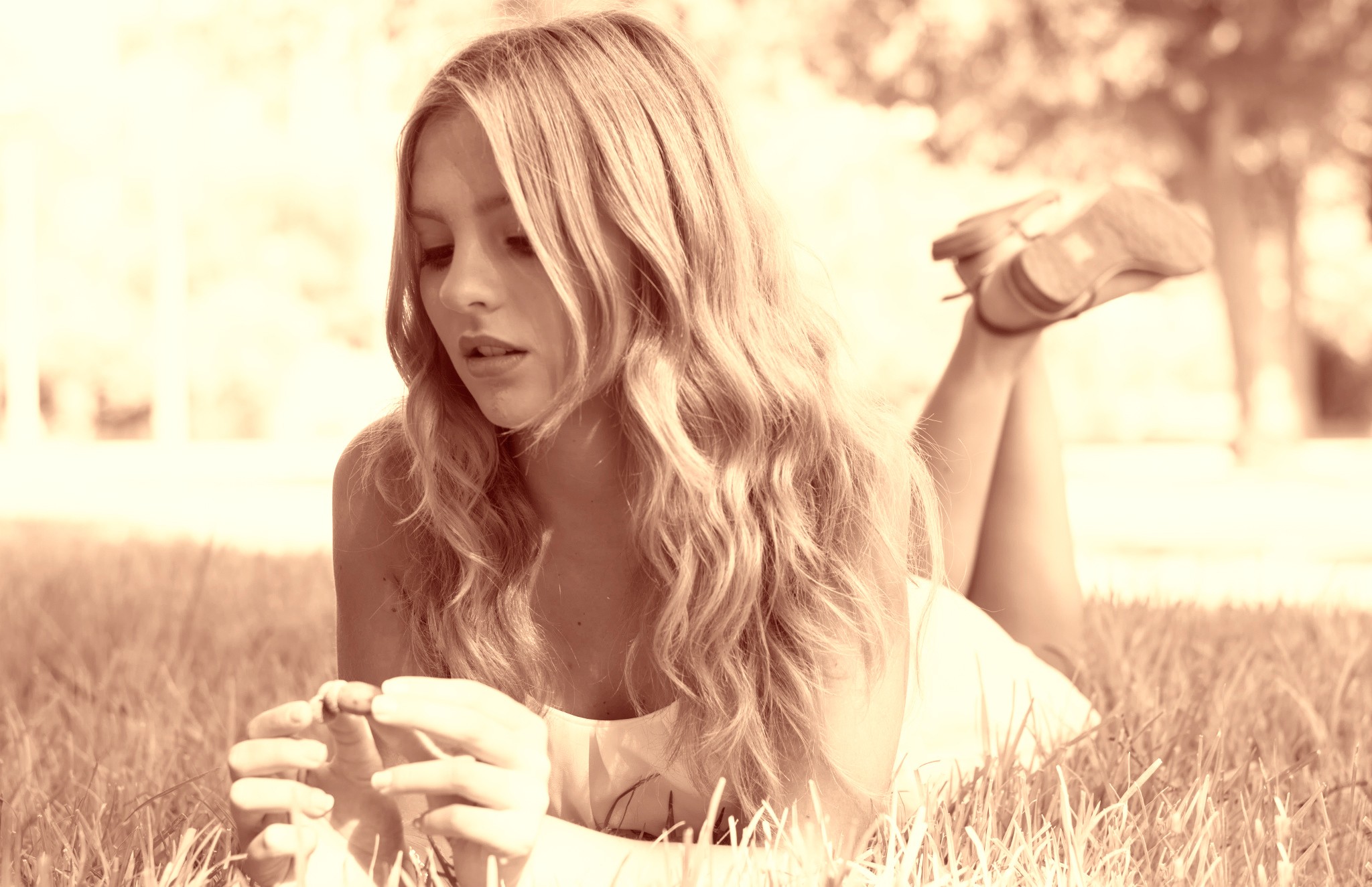 Woman lying on grass with blonde hair HD Wallpaper