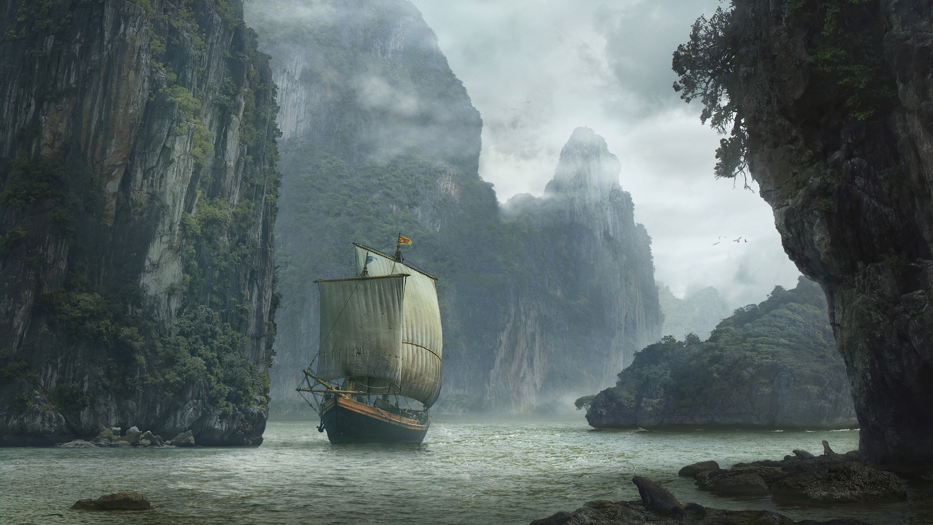 Sailing ship navigates through a misty bay with rocky cliffs HD Wallpaper