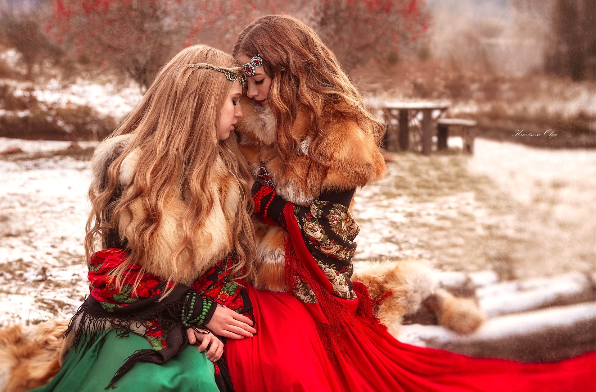 Two women in traditional clothing in a snowy landscape HD Wallpaper