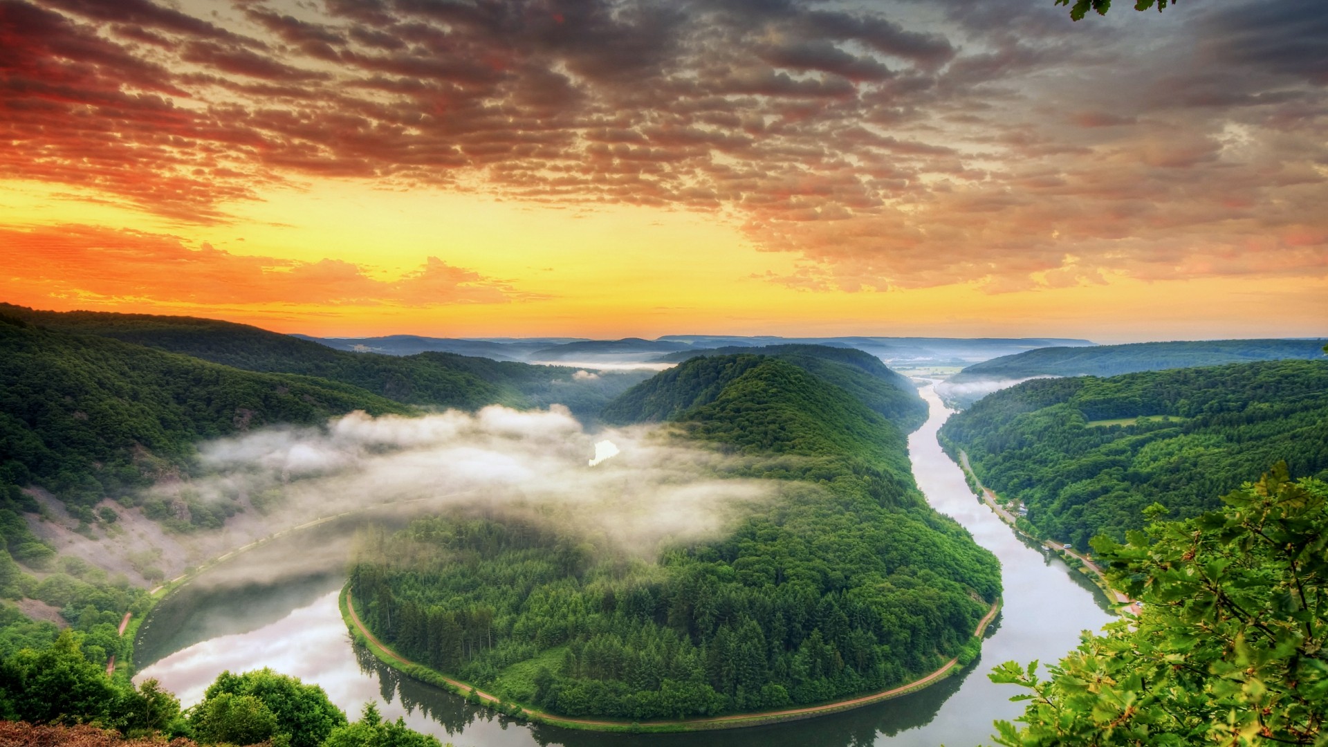 Saarschleife river bend at sunset with mist HD Wallpaper