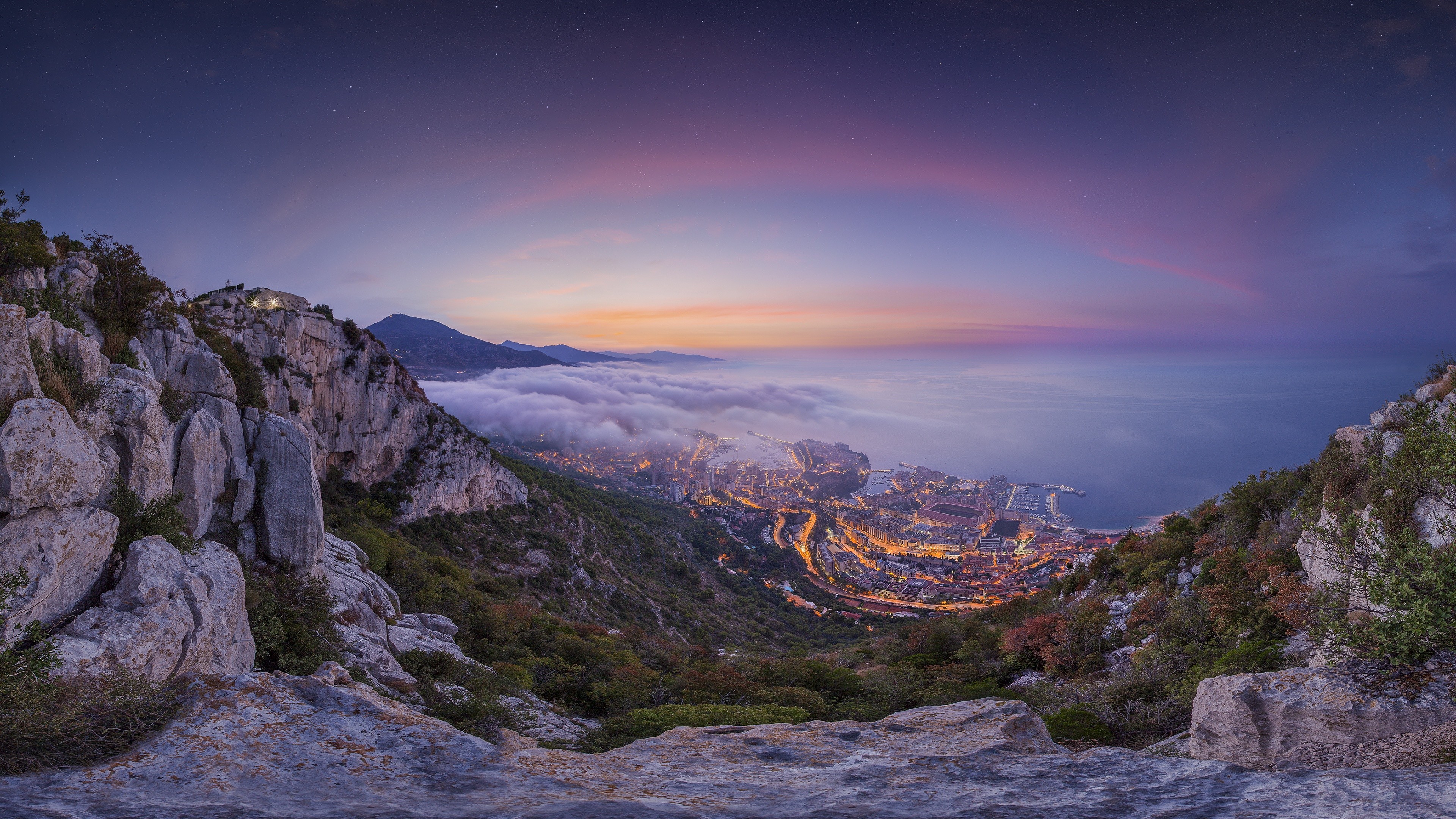 Monaco cityscape at dusk with clouds and mountains HD Wallpaper