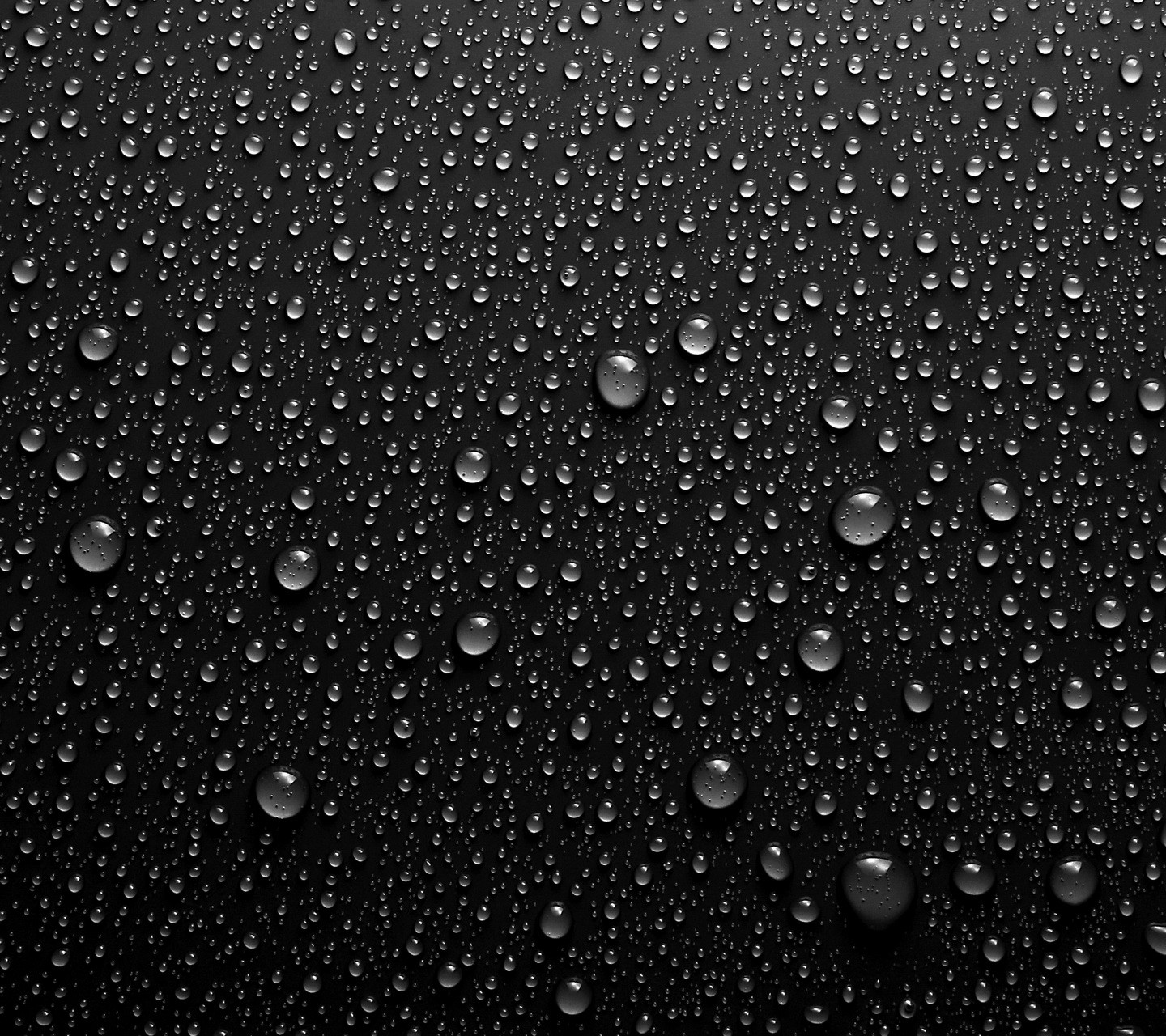 Water droplets on a dark surface HD Wallpaper