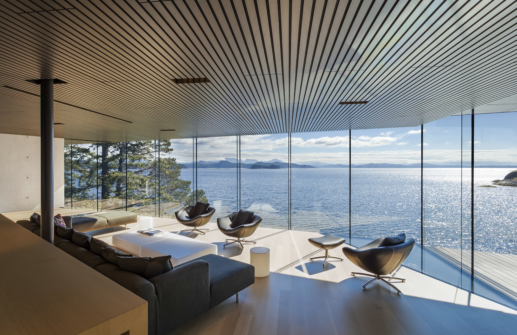 Modern living room with panoramic sea view HD Wallpaper