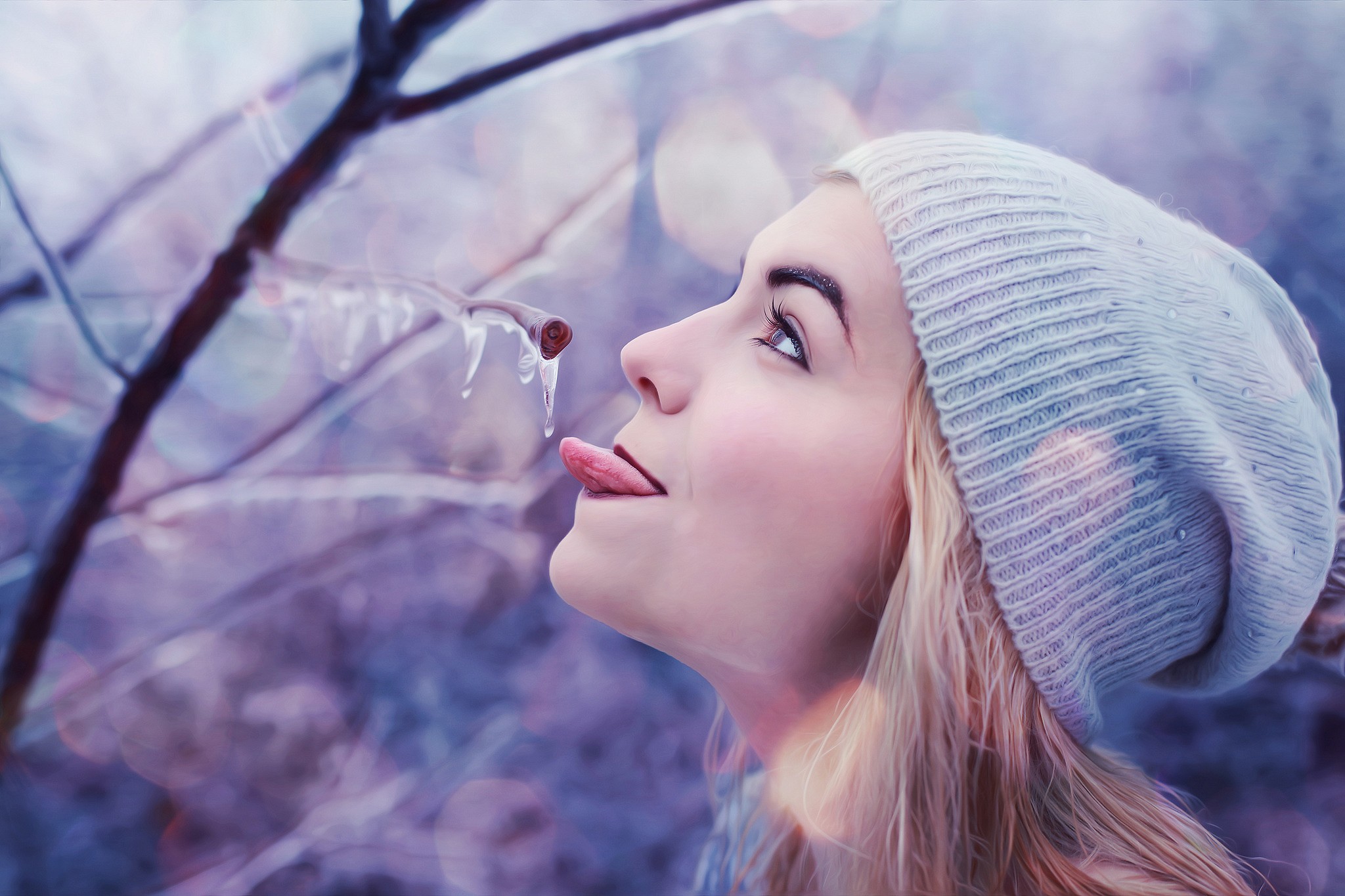 Woman licking icicles on a tree branch HD Wallpaper