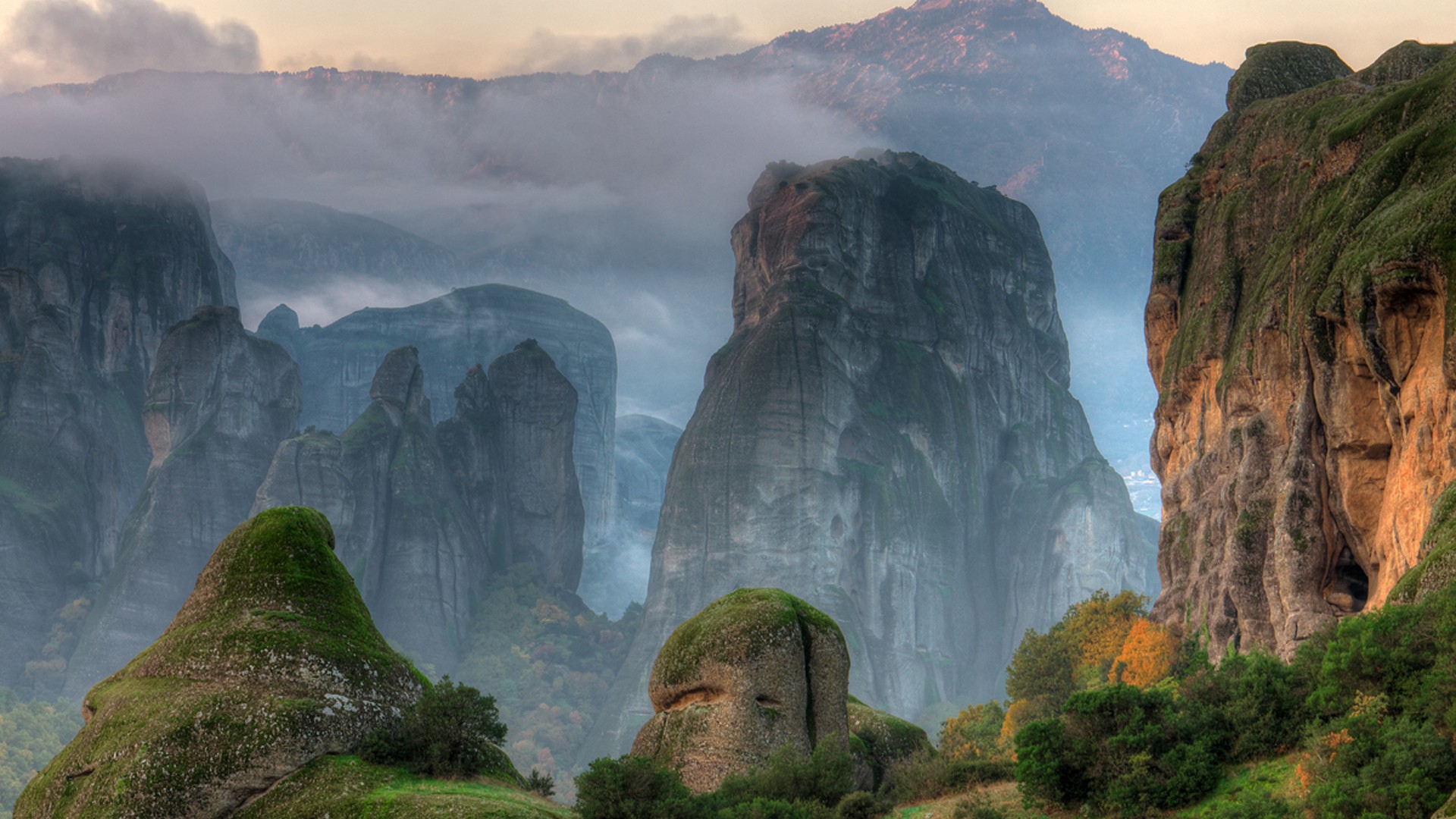 Misty Mountains and Rock Formations at Meteora HD Wallpaper
