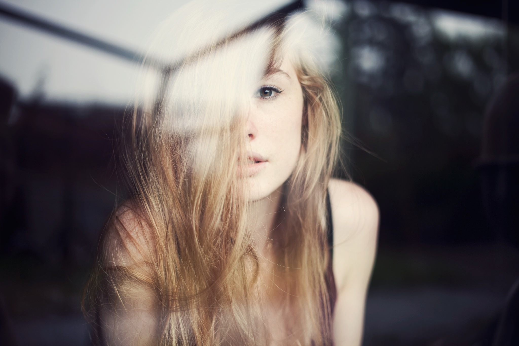 Woman with blonde hair looking through a window HD Wallpaper