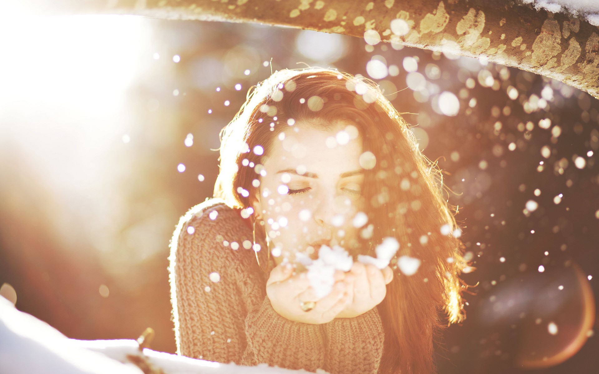 Woman blowing snow in winter sunlight HD Wallpaper