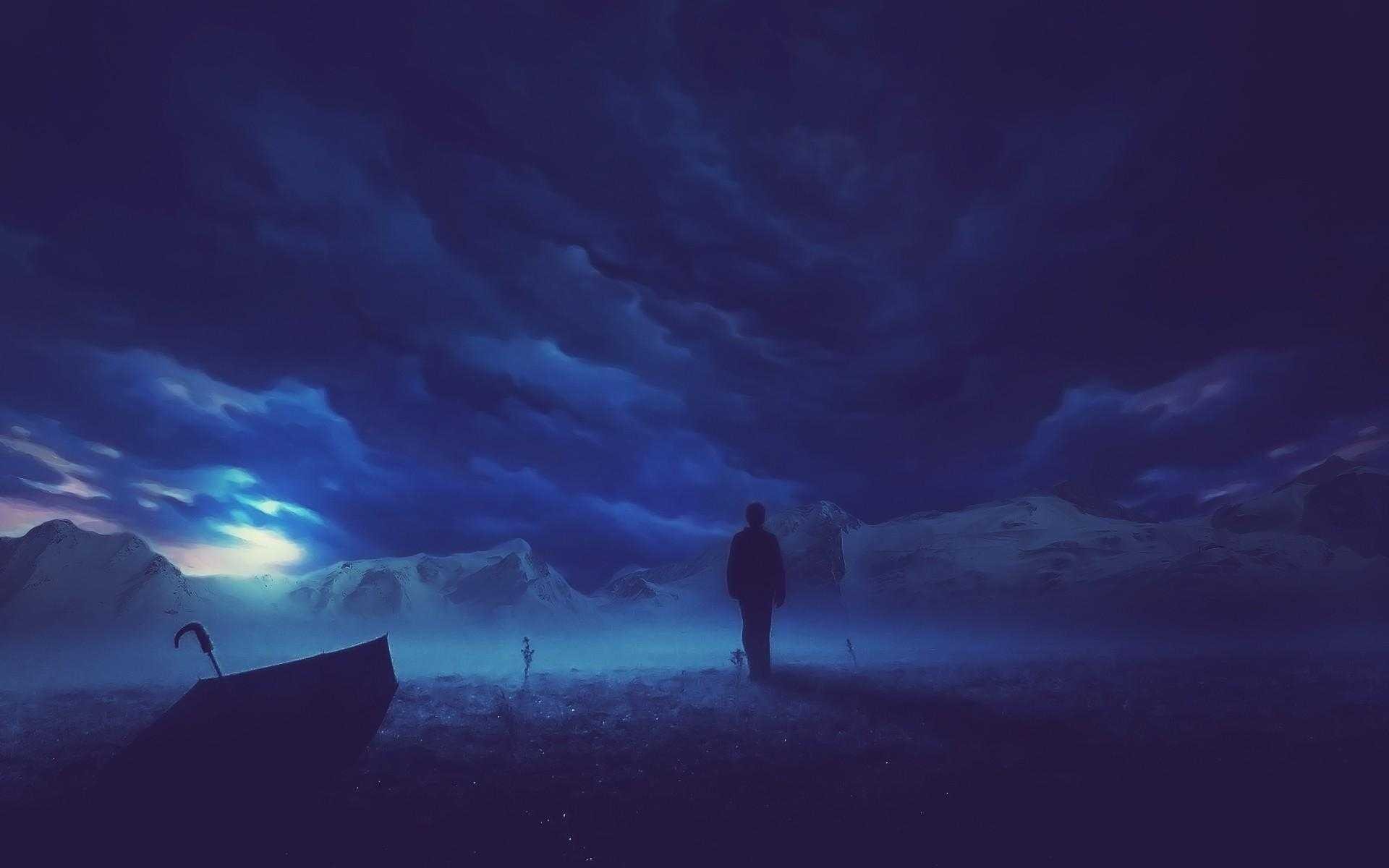 Silhouette of a person in a cloudy, mountainous landscape HD Wallpaper