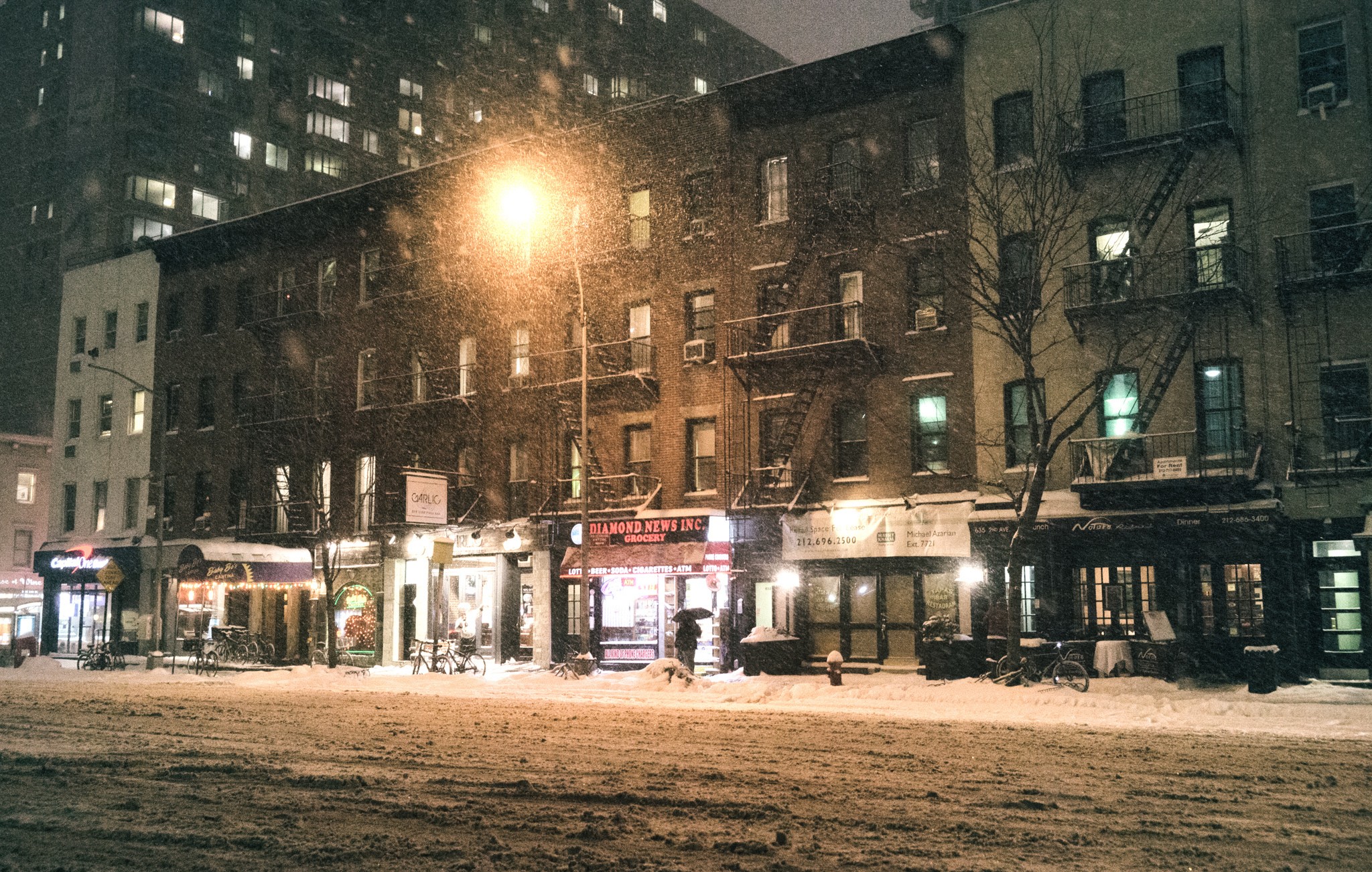 Snowy street in New York City at night HD Wallpaper