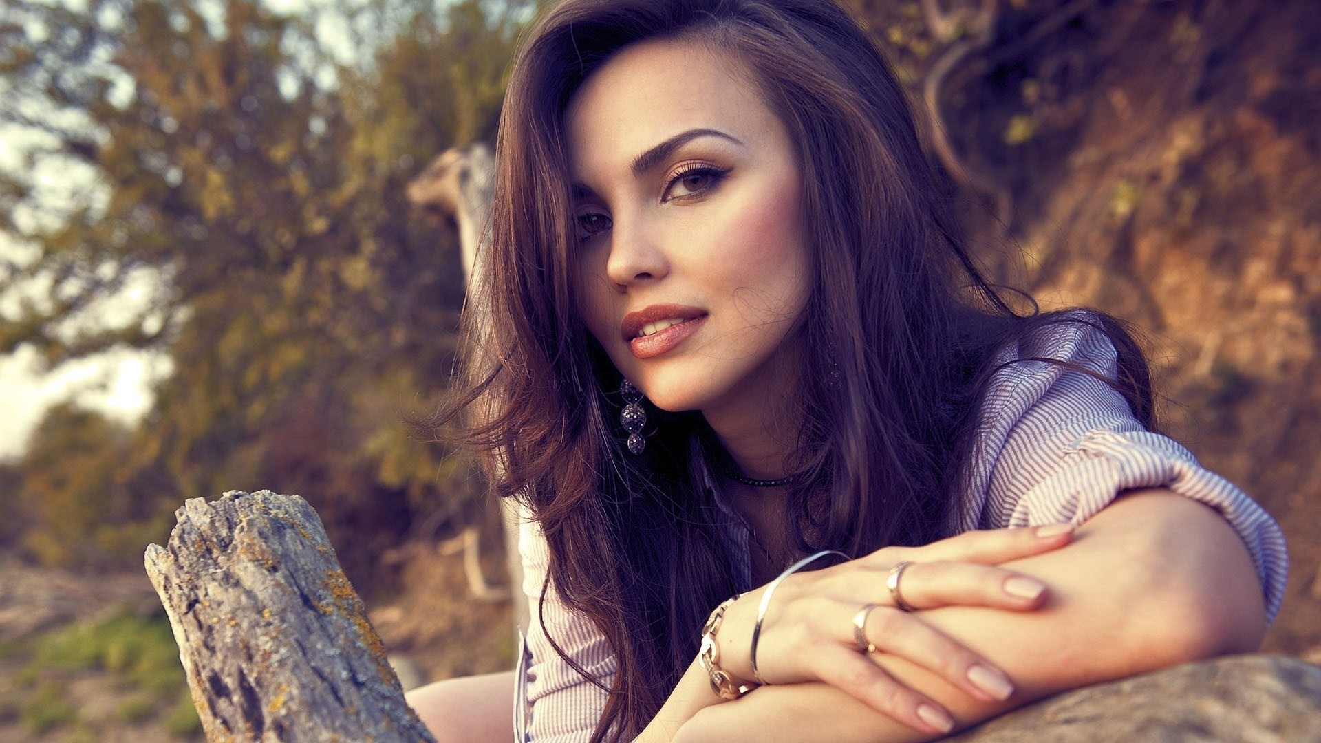 Woman with long brown hair and jewelry HD Wallpaper