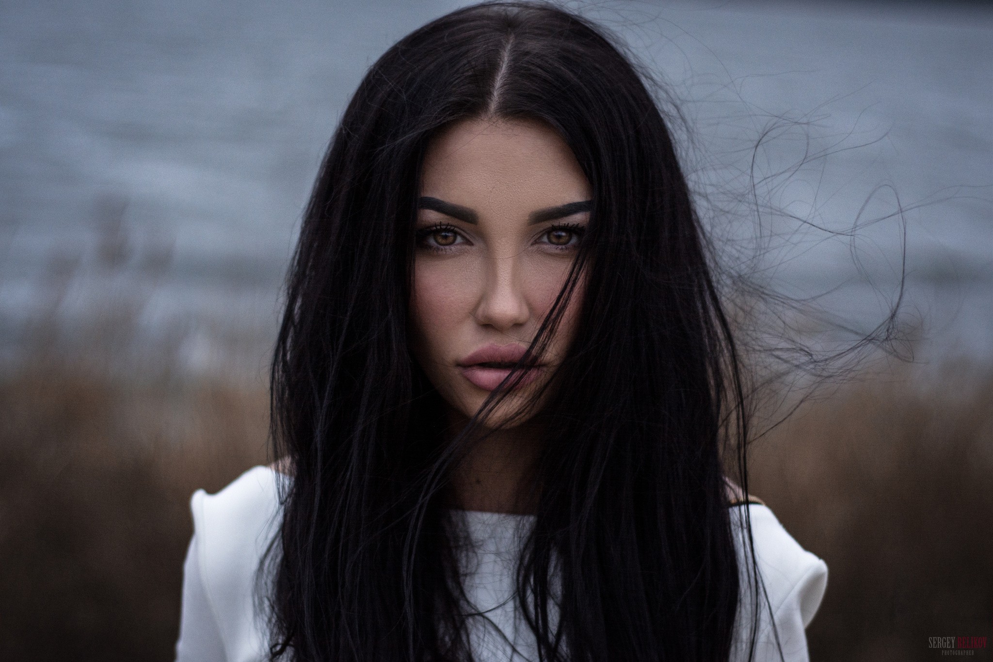Woman with long dark hair and juicy lips HD Wallpaper
