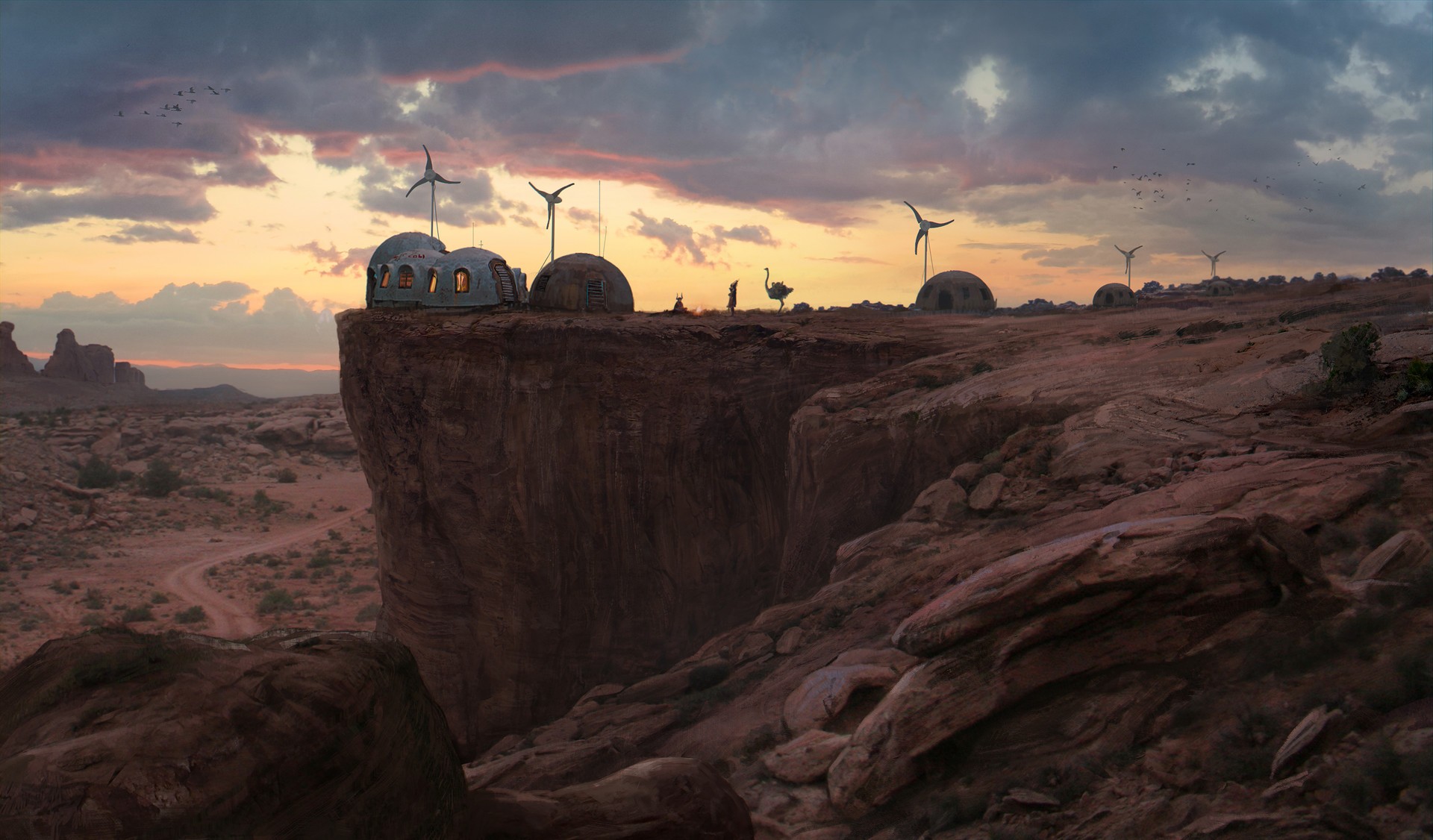 Desert village with wind turbines on a cliff at sunset HD Wallpaper