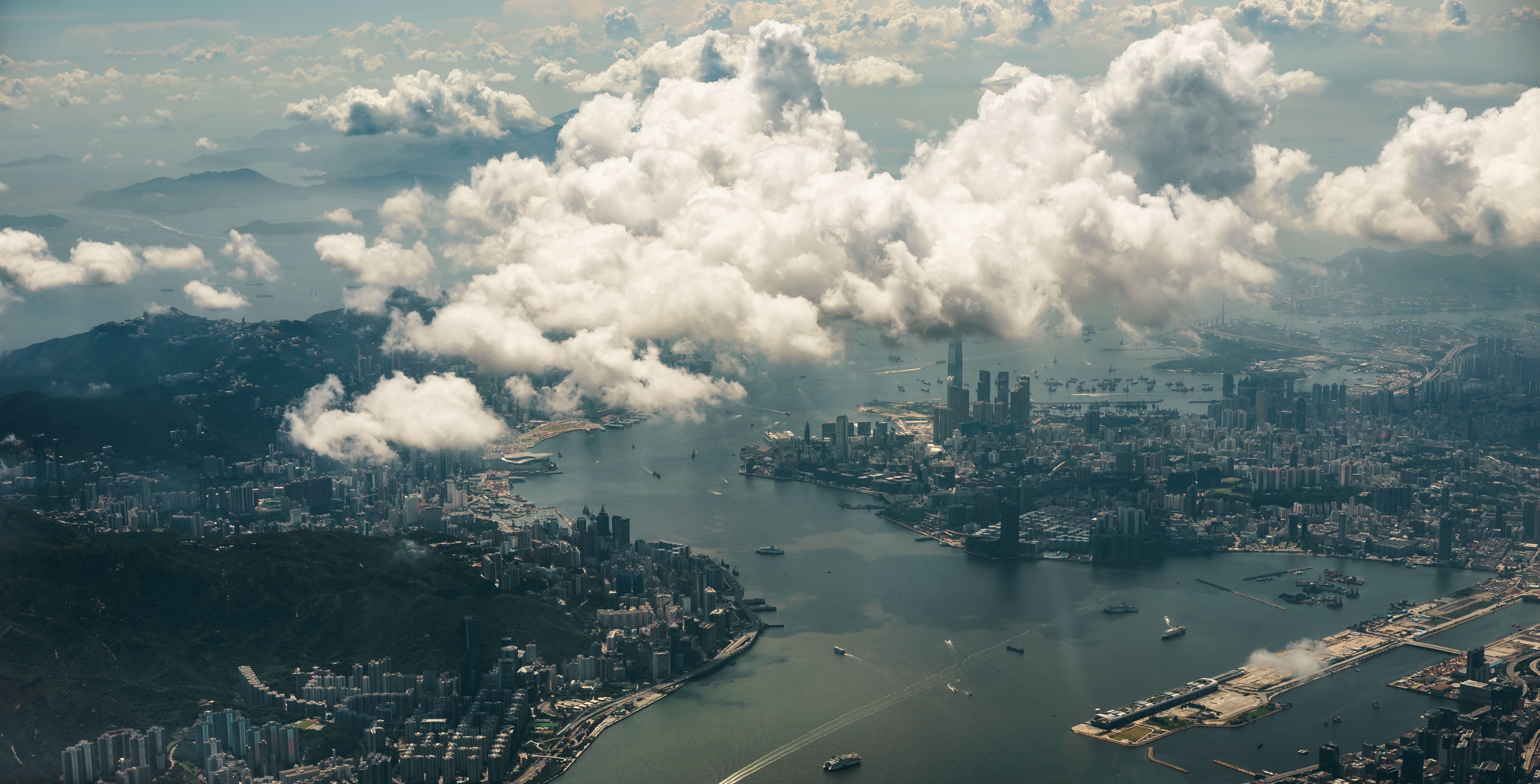 Aerial view of Hong Kong harbor with clouds HD Wallpaper