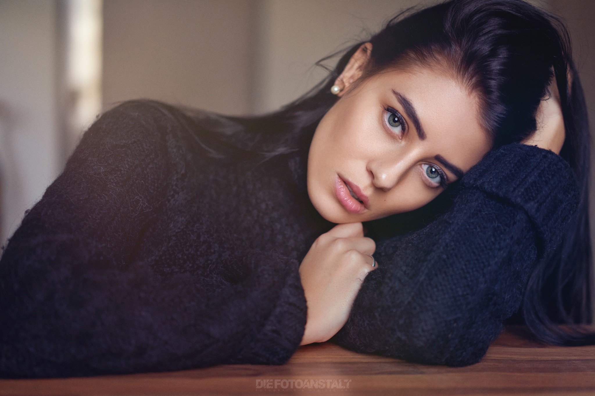 Woman with dark hair wearing a black sweater HD Wallpaper
