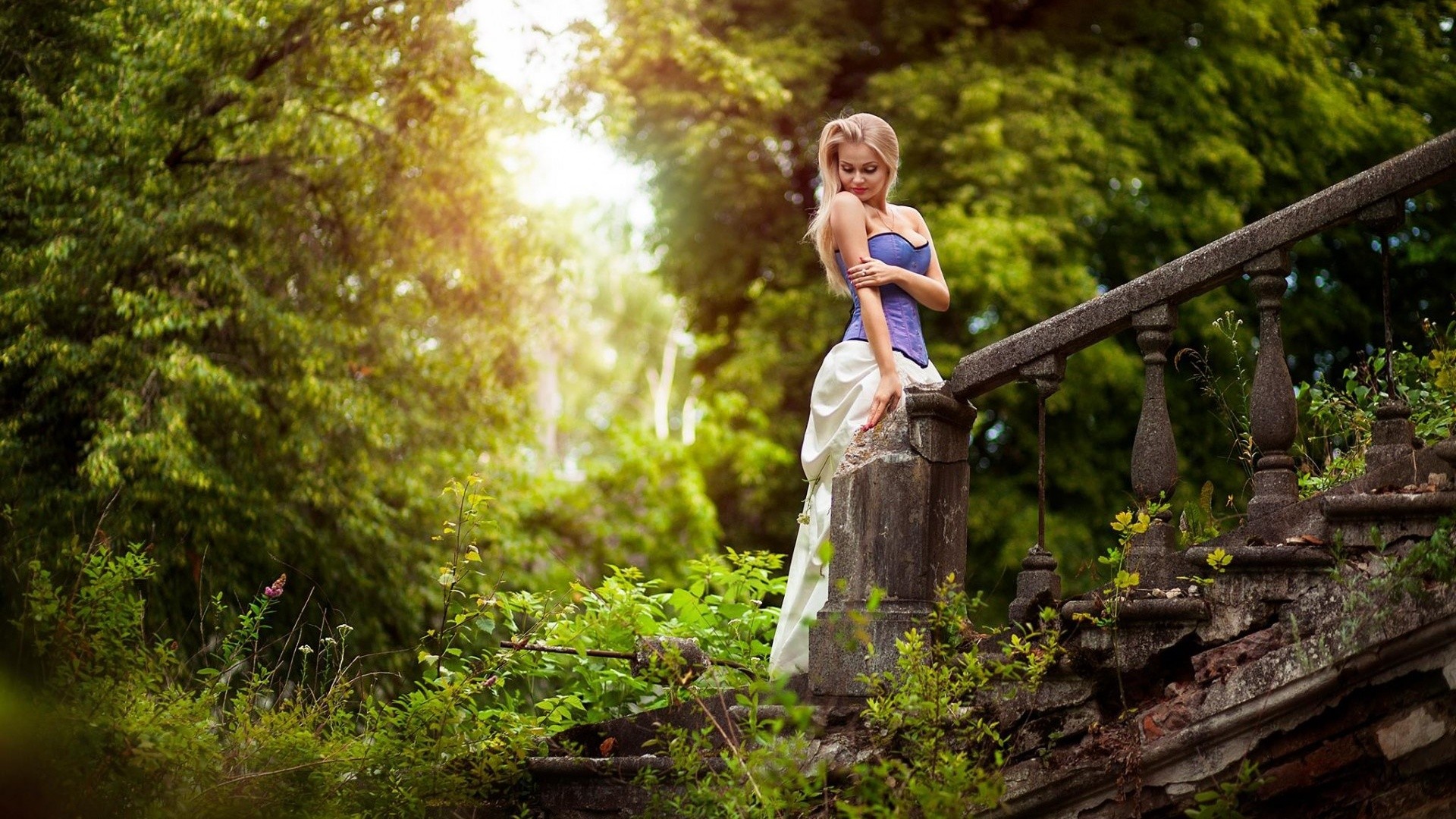 Woman in corset and dress on ruined stairs in forest HD Wallpaper