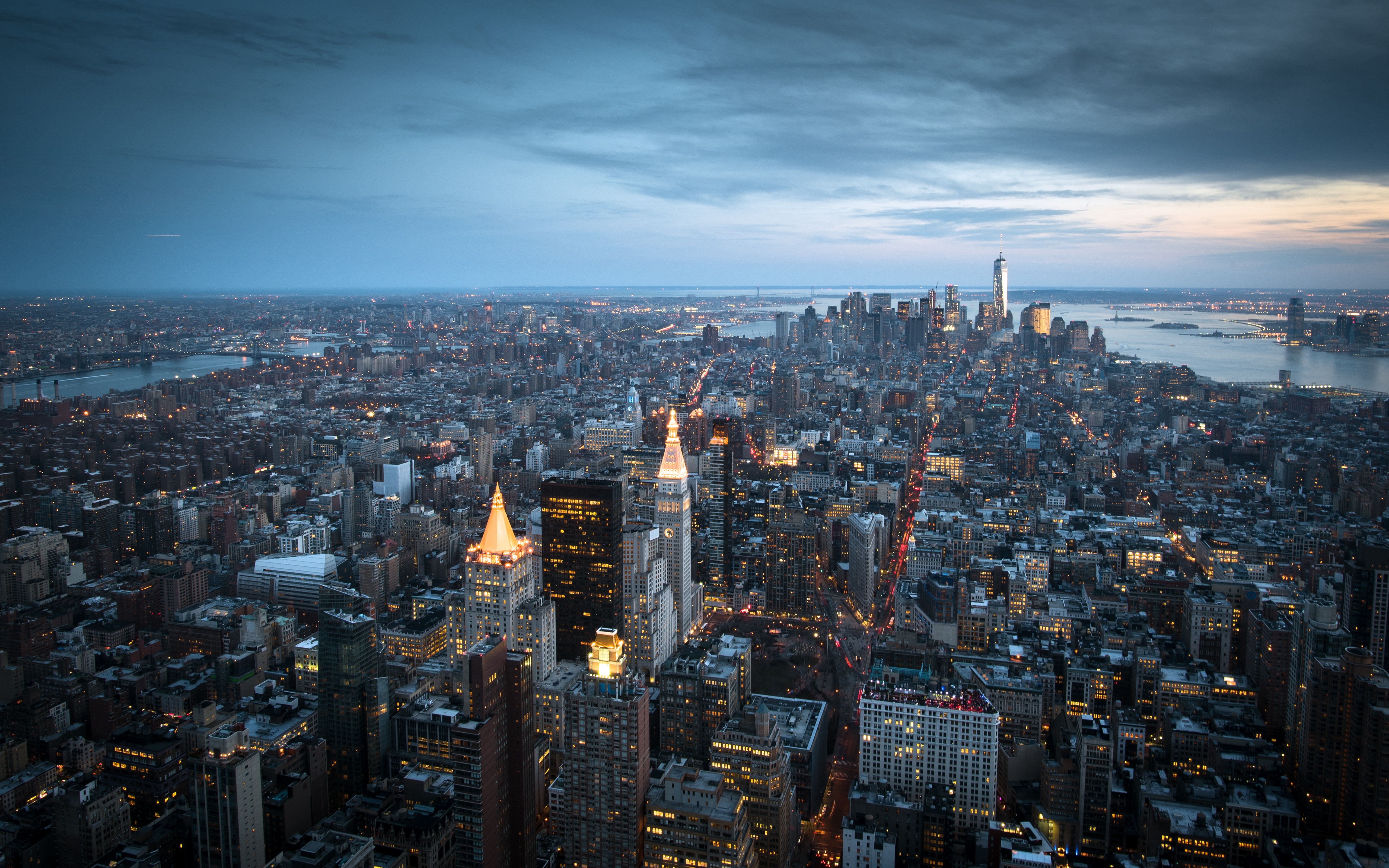 New York City skyline at dusk with city lights HD Wallpaper
