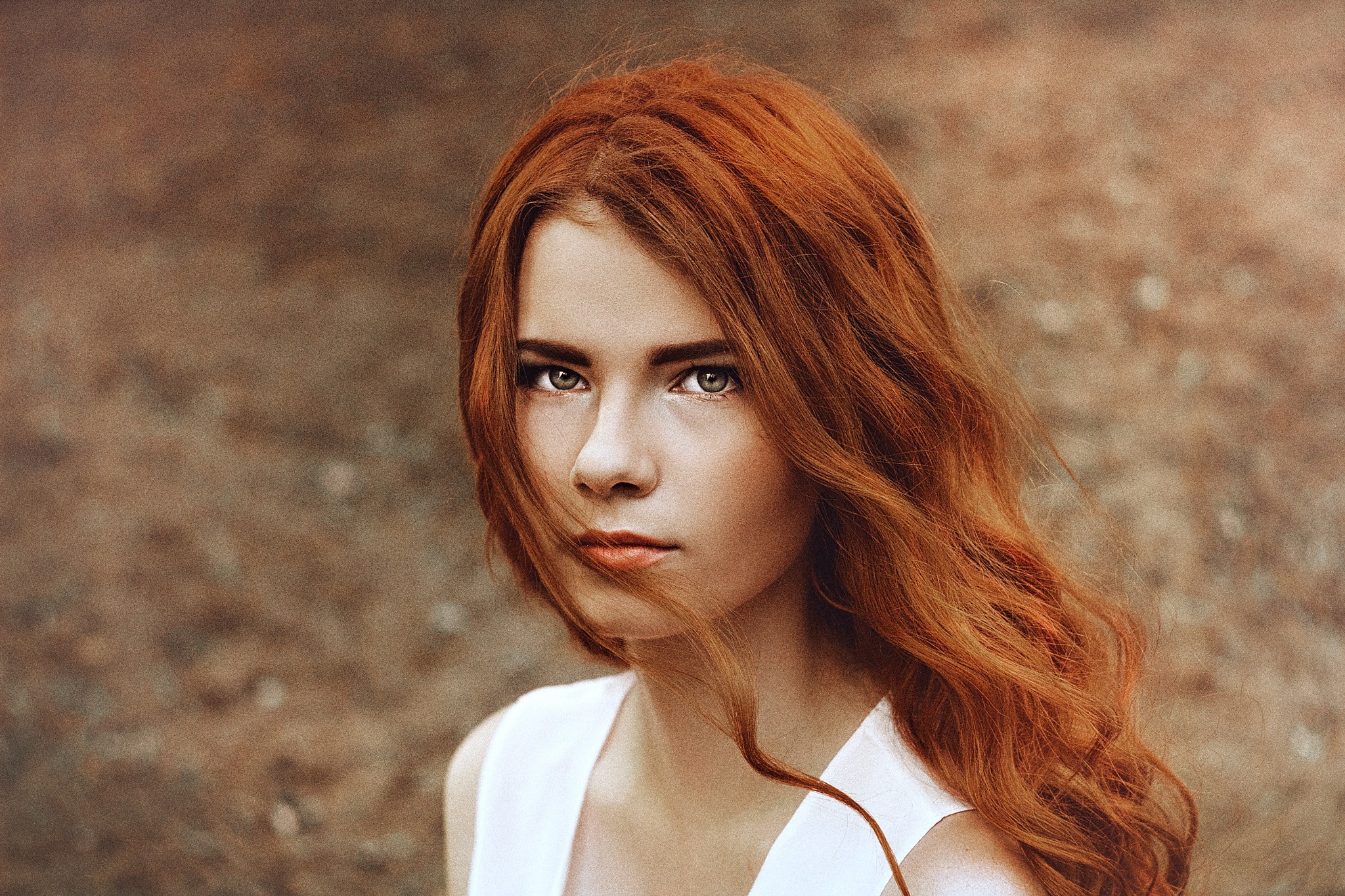 Redhead woman with long wavy hair looking at viewer HD Wallpaper