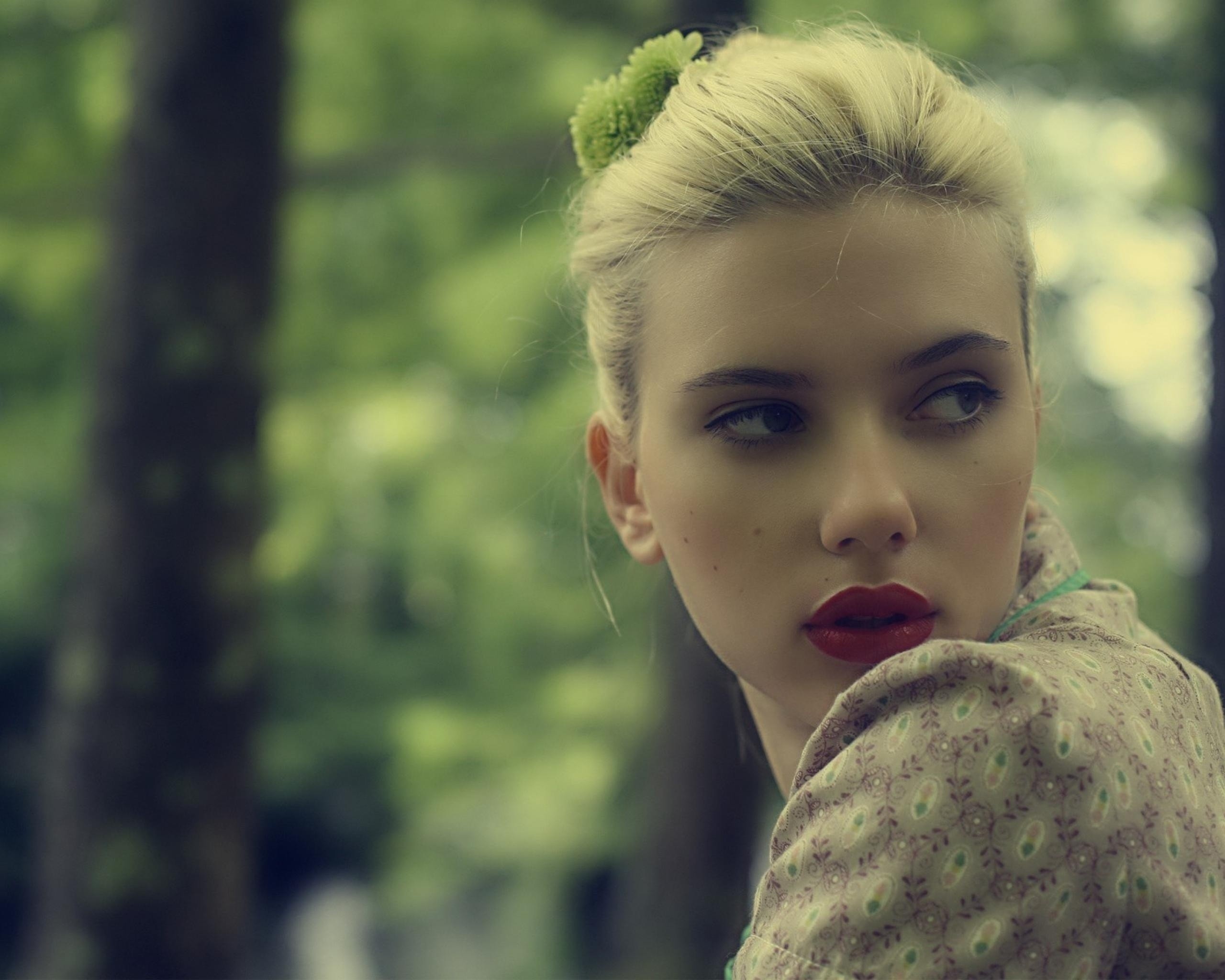Scarlett Johansson with a green flower in her hair HD Wallpaper