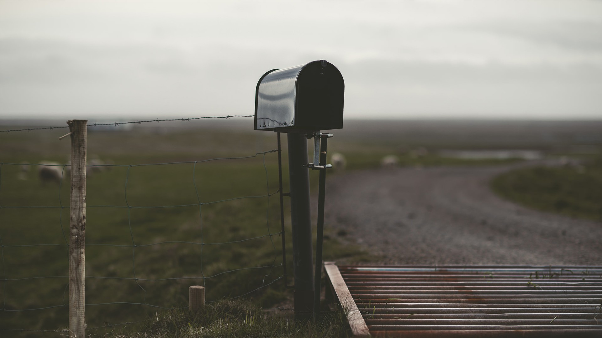 Black mailbox on a rural fence line HD Wallpaper