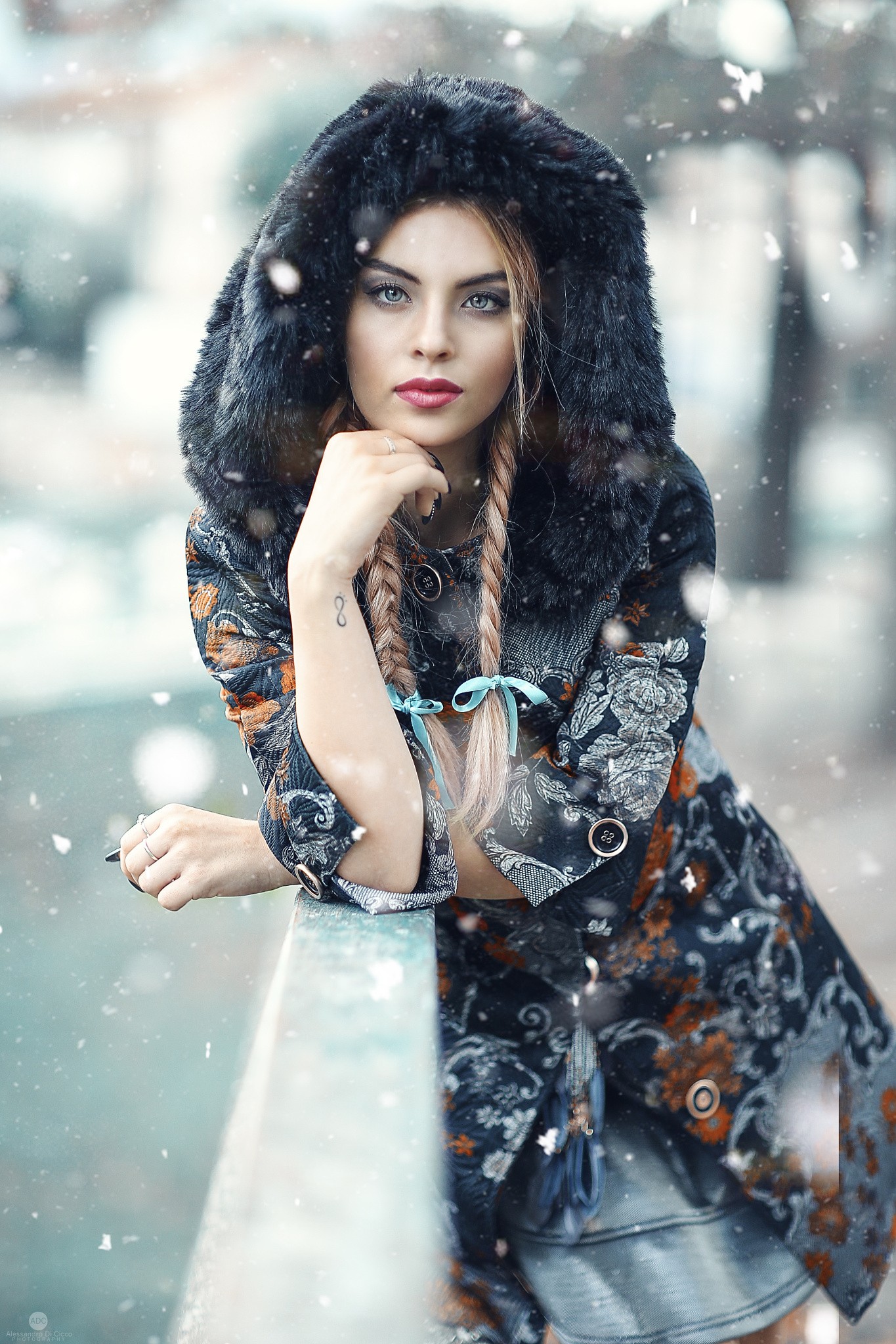 Woman with blonde hair in a fur-hooded coat in snow HD Wallpaper