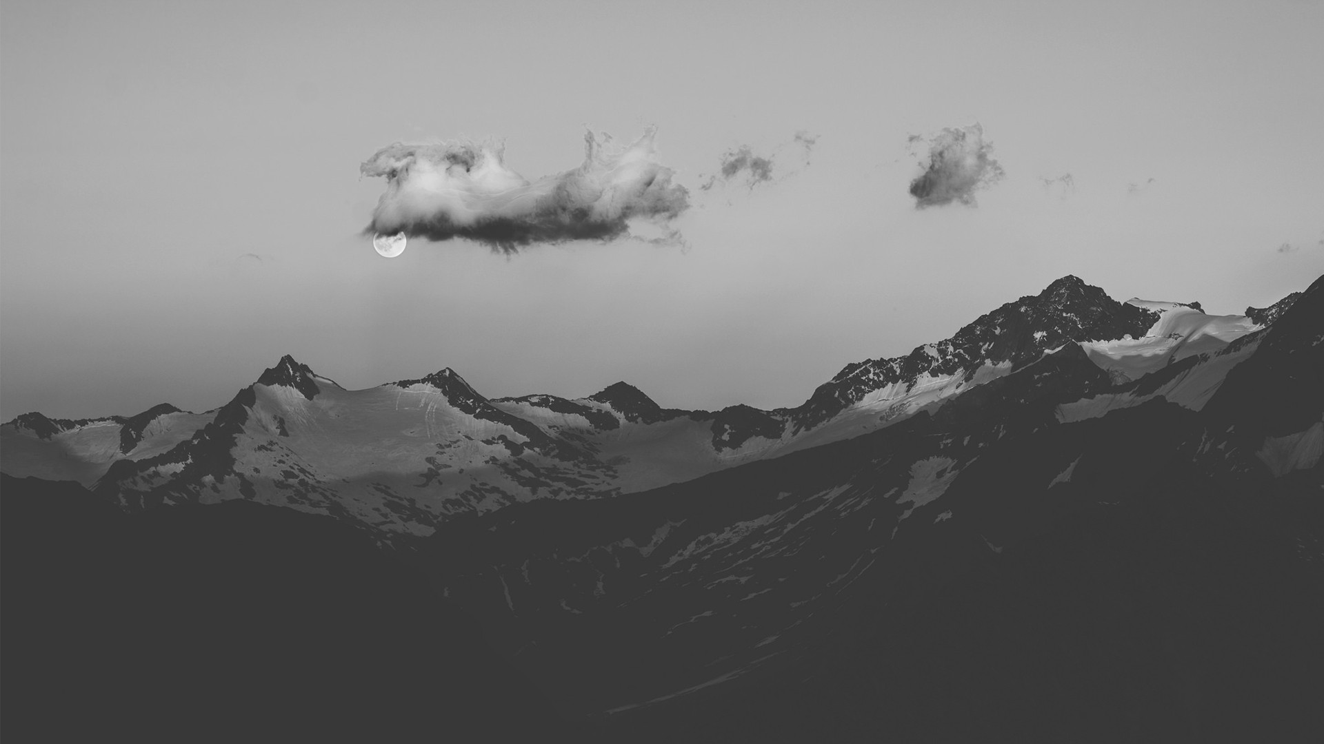 Moon behind clouds over snow-capped mountains HD Wallpaper