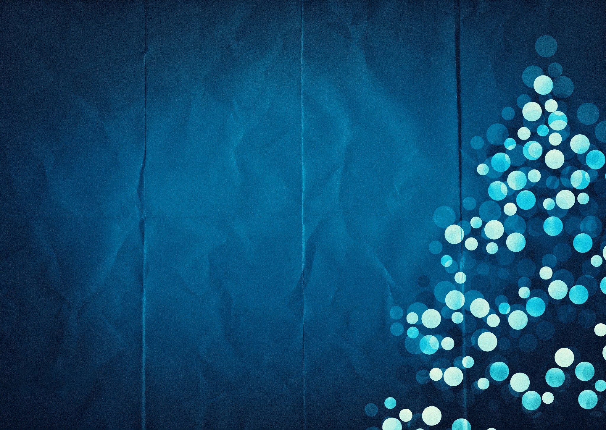 Christmas tree made of bokeh lights on blue paper HD Wallpaper
