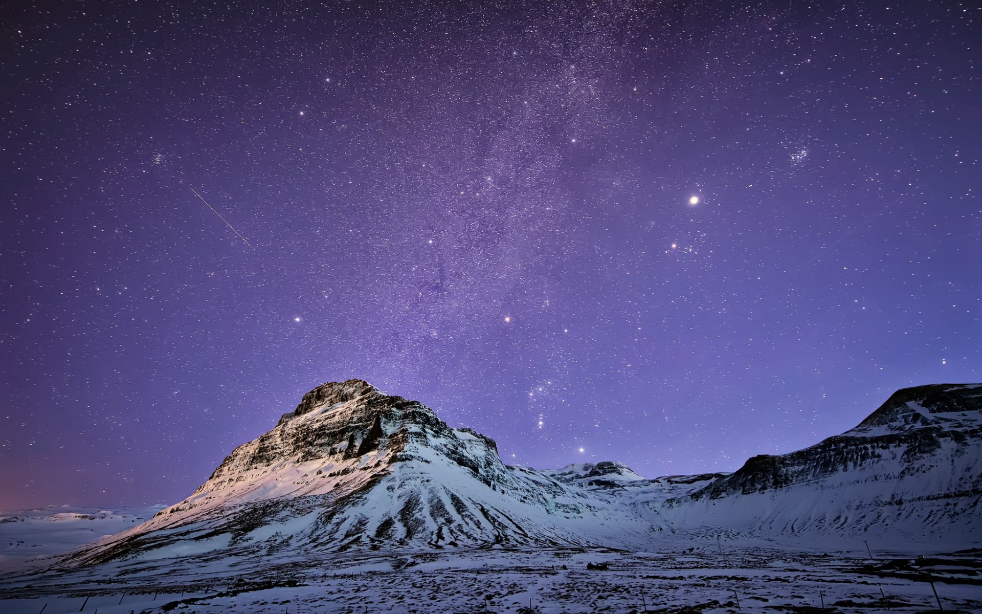 Snowy mountains under a starry night sky HD Wallpaper