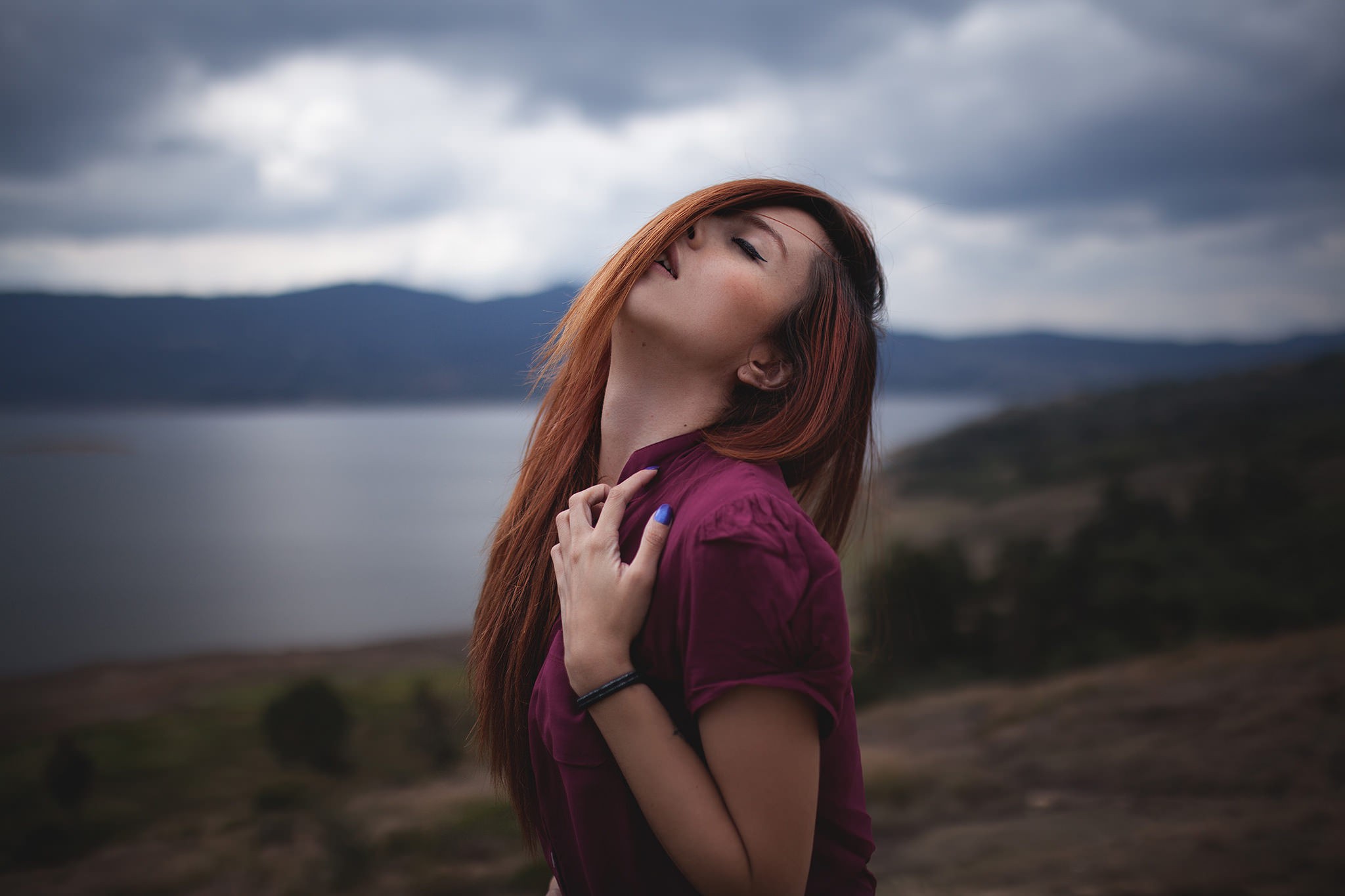 Woman with red hair outdoors by a lake HD Wallpaper