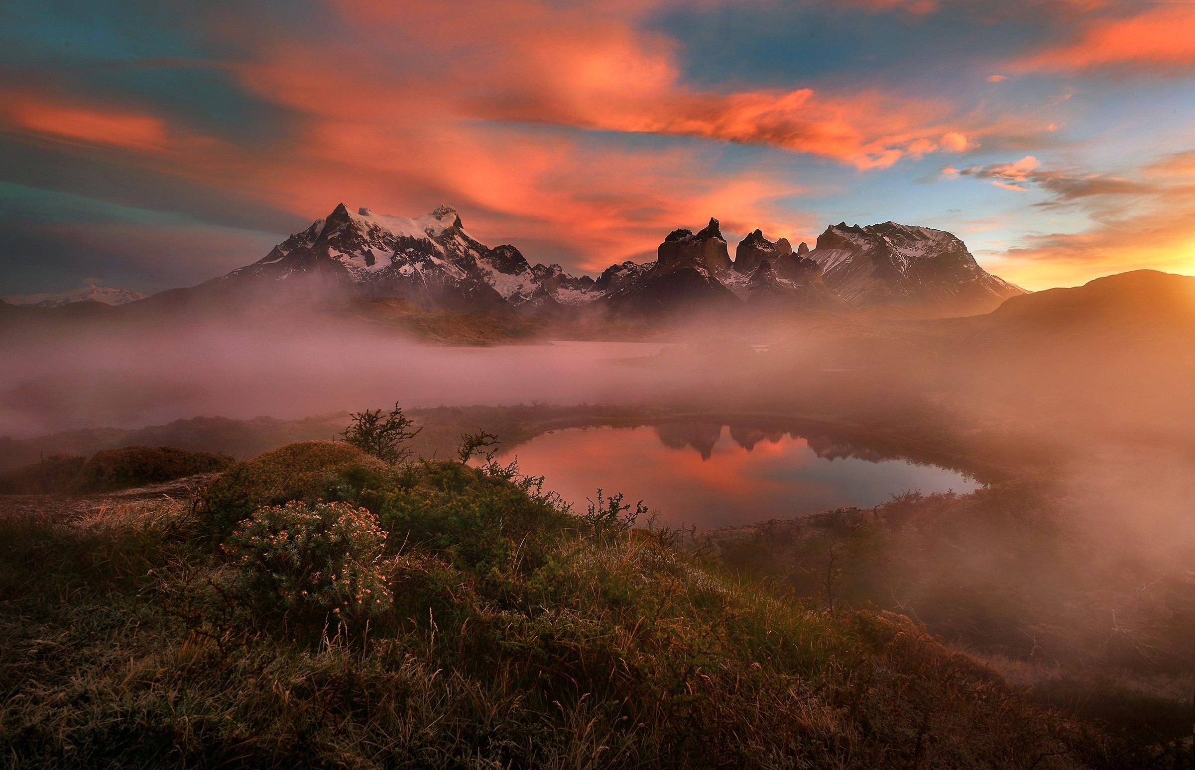 Mountains and clouds over a lake at sunset HD Wallpaper
