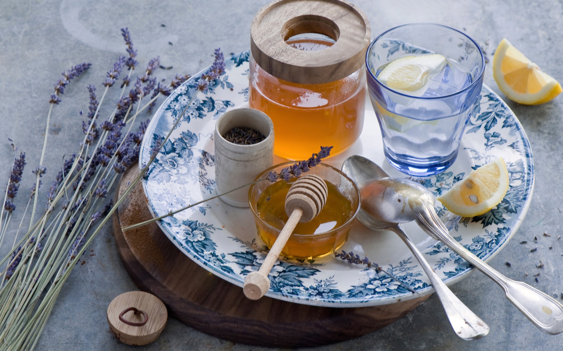 Lavender, honey, lemon, and cutlery on a plate HD Wallpaper