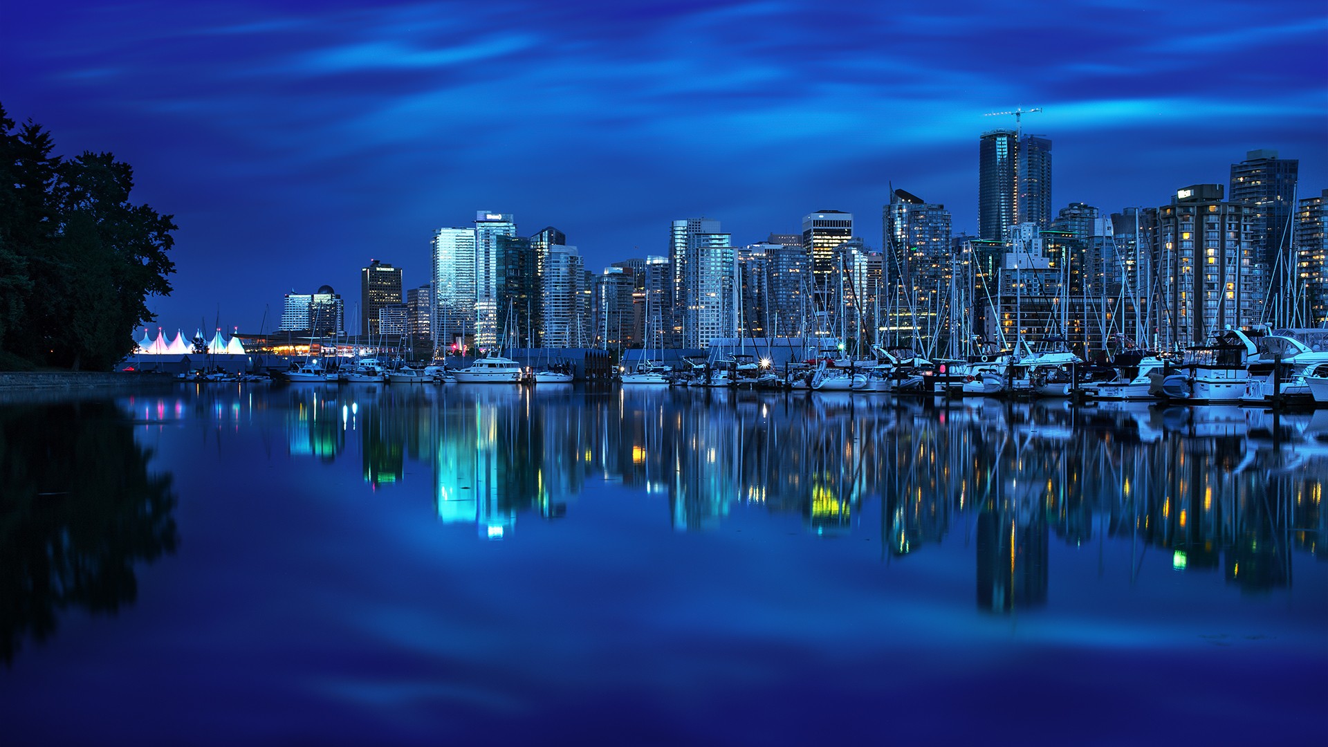 Vancouver skyline at night with boats in the harbor HD Wallpaper